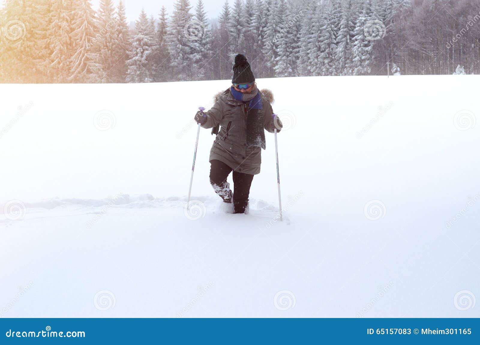 Front View Of A Person Walking Through Deep Snow Stock Image - 
