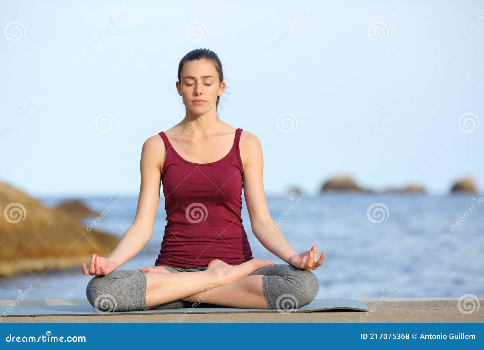 Concentrated Woman Doing Yoga on the Beach Stock Photo Image of