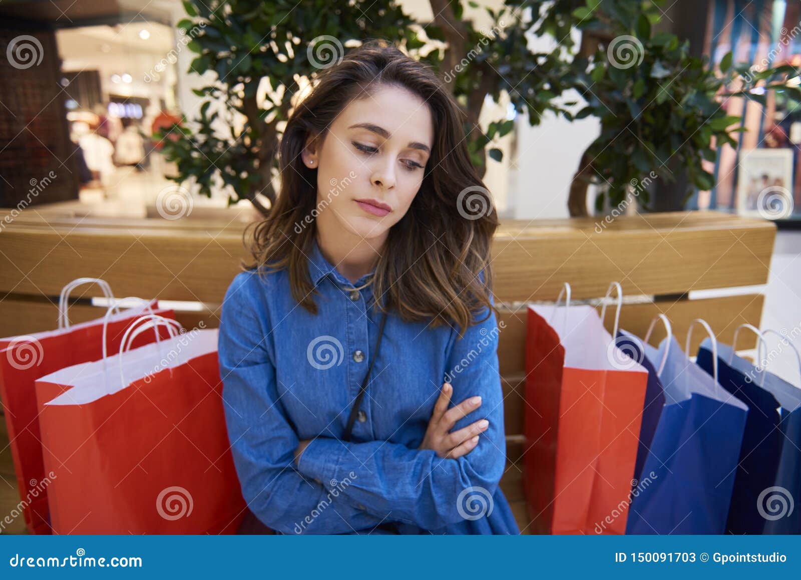 sad woman spent all her money during big shopping