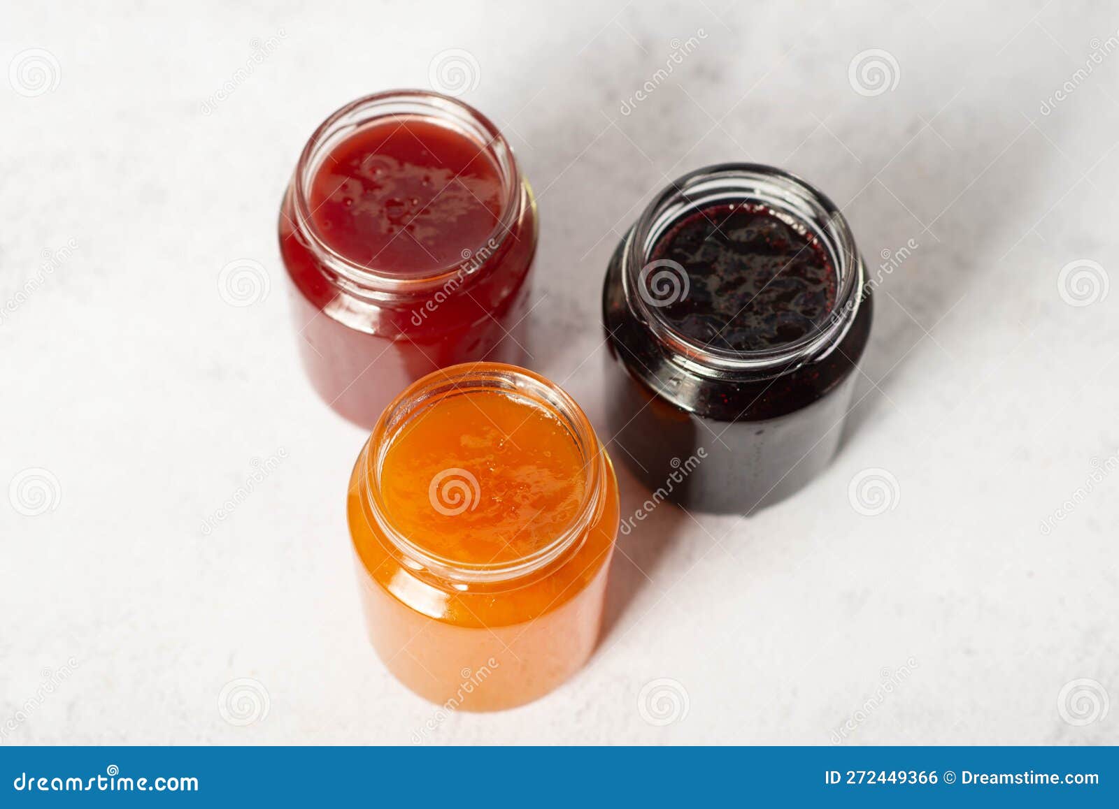 Front View of Set of Small Jam and Vegetable Jars in Different Colors