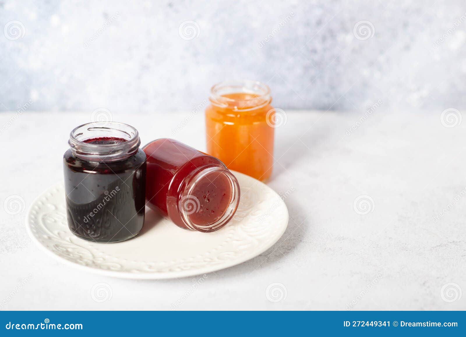 Front View of Set of Small Jam and Vegetable Jars in Different Colors