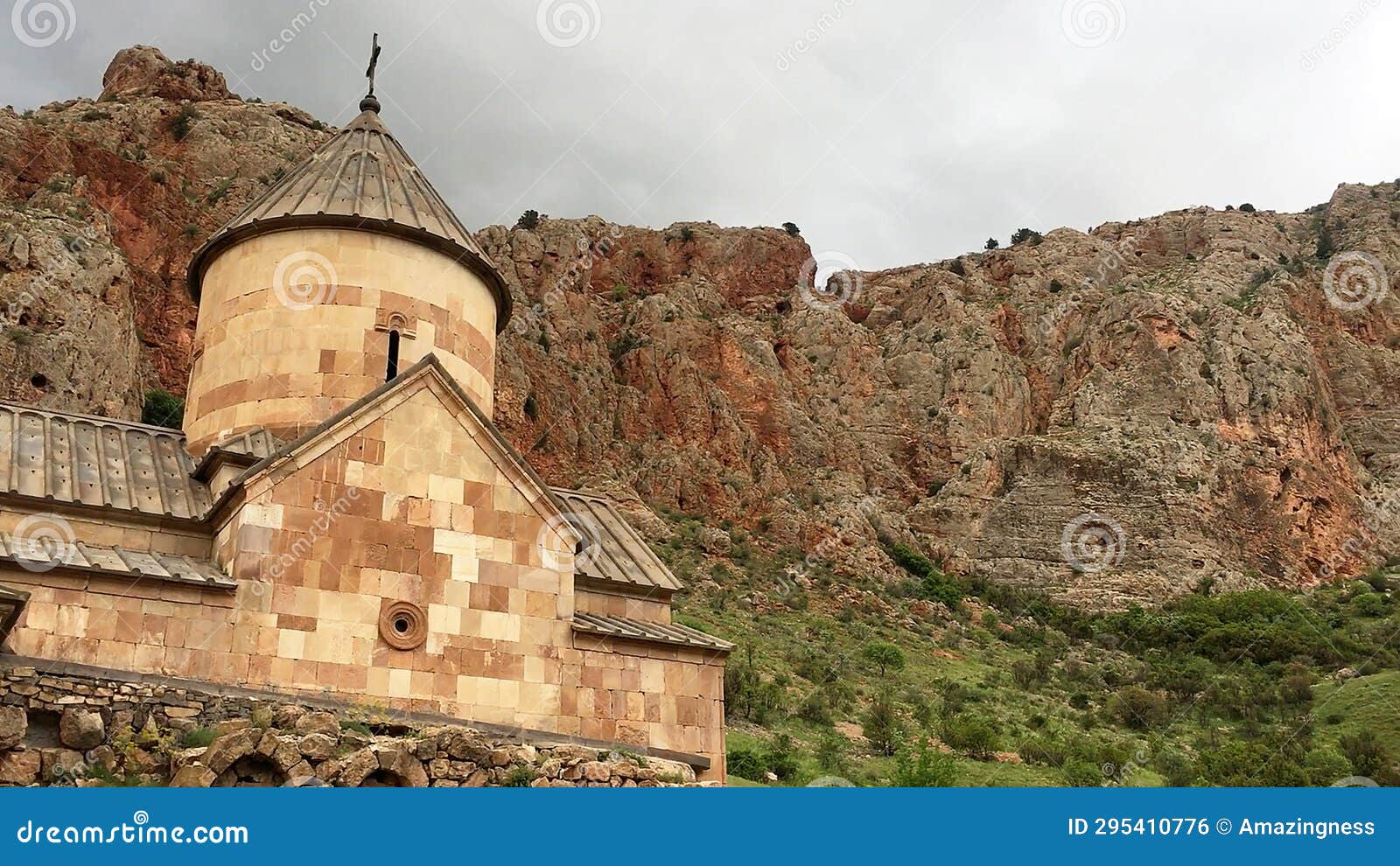 front view of surb karapet church with mountain scenery at noravank monastery.