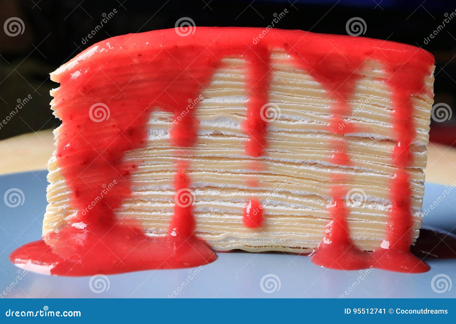 Front View Of The Texture Of Mille Crepe Cake With Raspberry Sauce