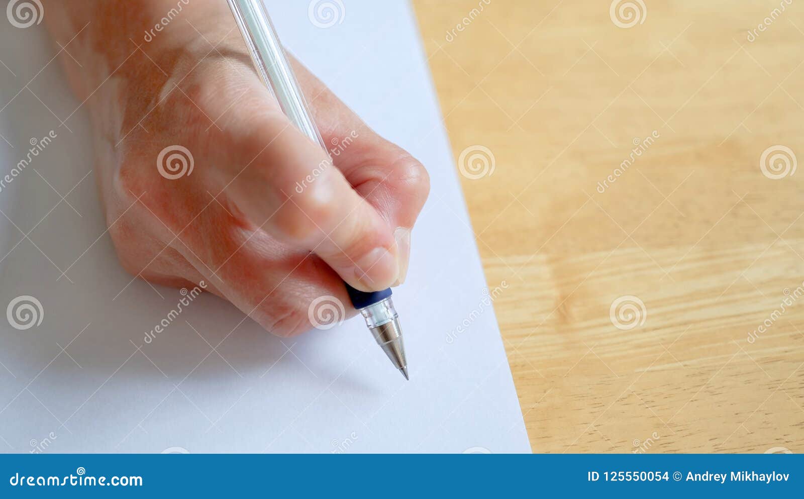 A Front View of a Woman`s Hand, Writing on a Sheet of Paper Stock Photo ...