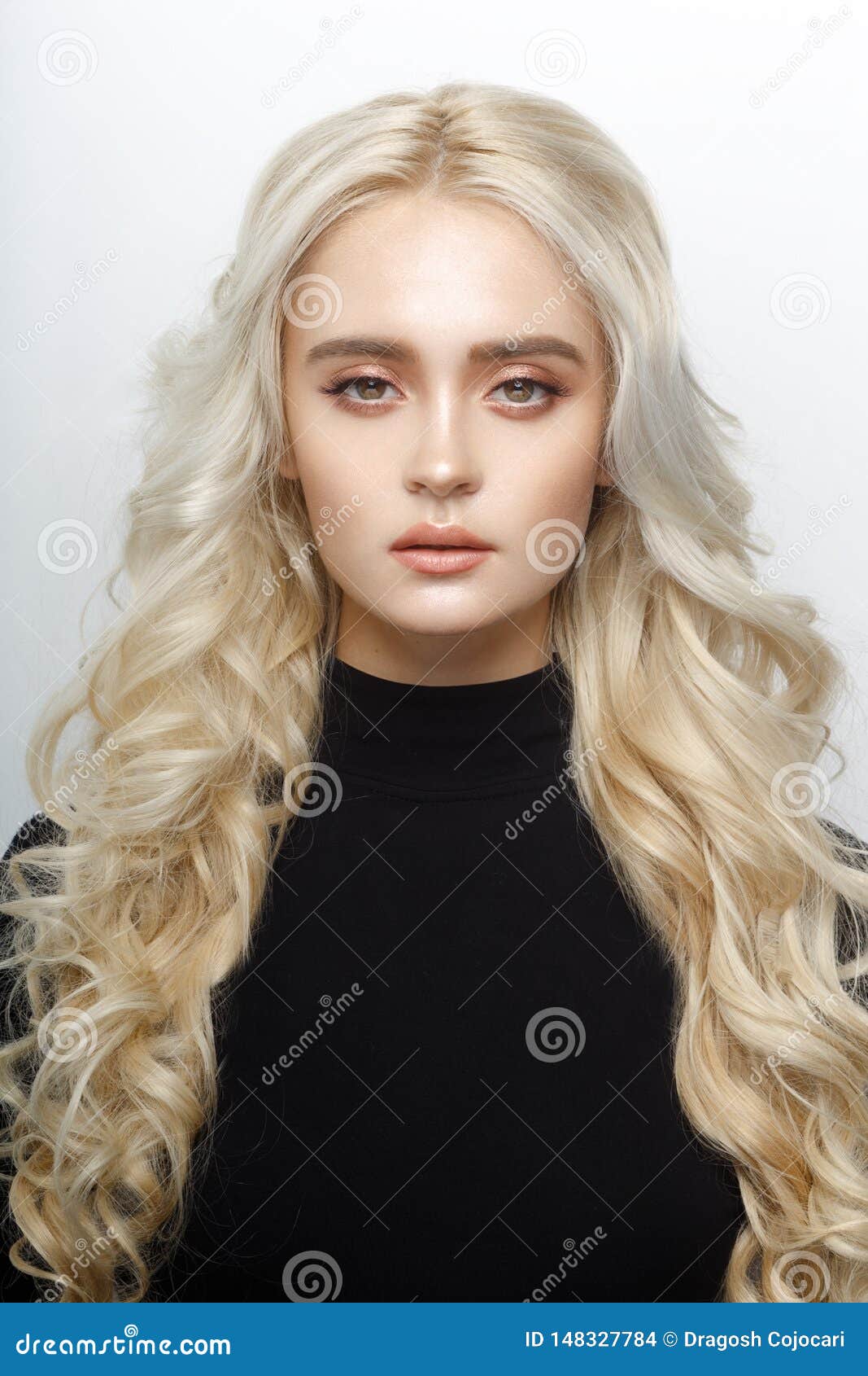 Frontal Portrait Of A Cute Blonde Girl With Delicate Make