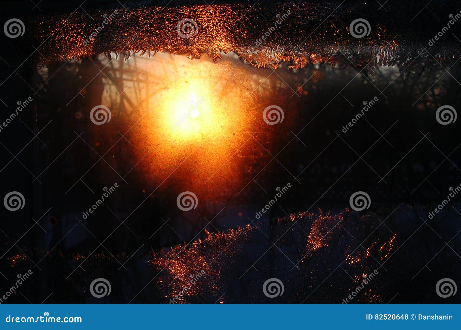 Frost Ice Crystals And Water Drops On Window Glass On The Background Of 