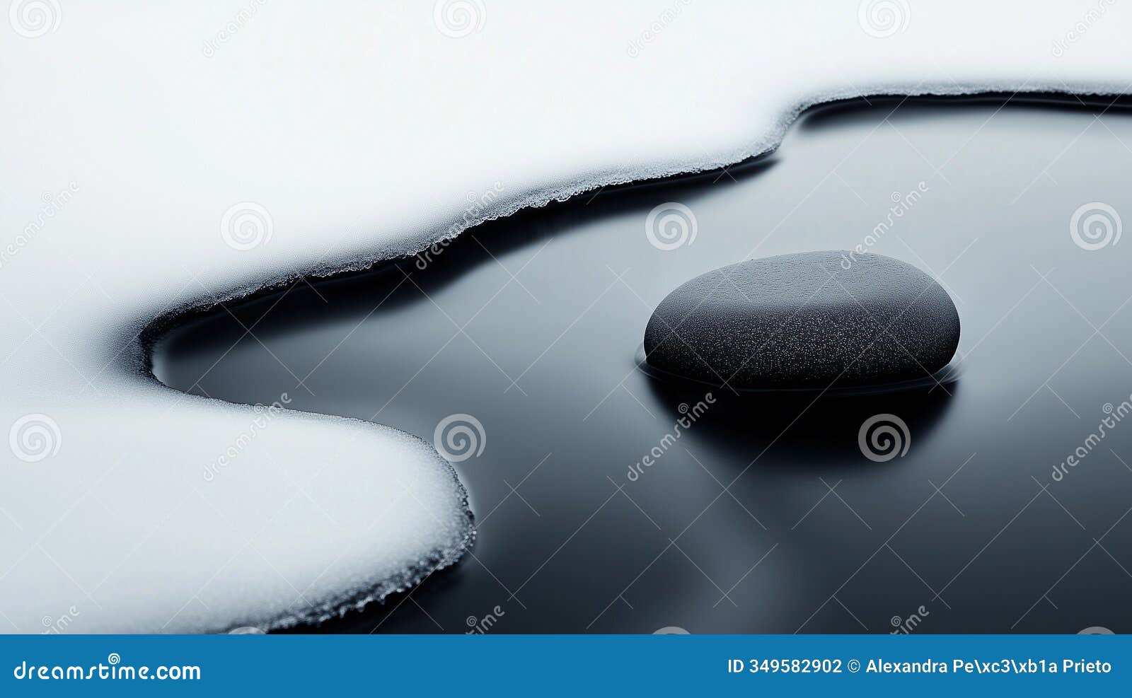 frosted stone in tranquil icy water