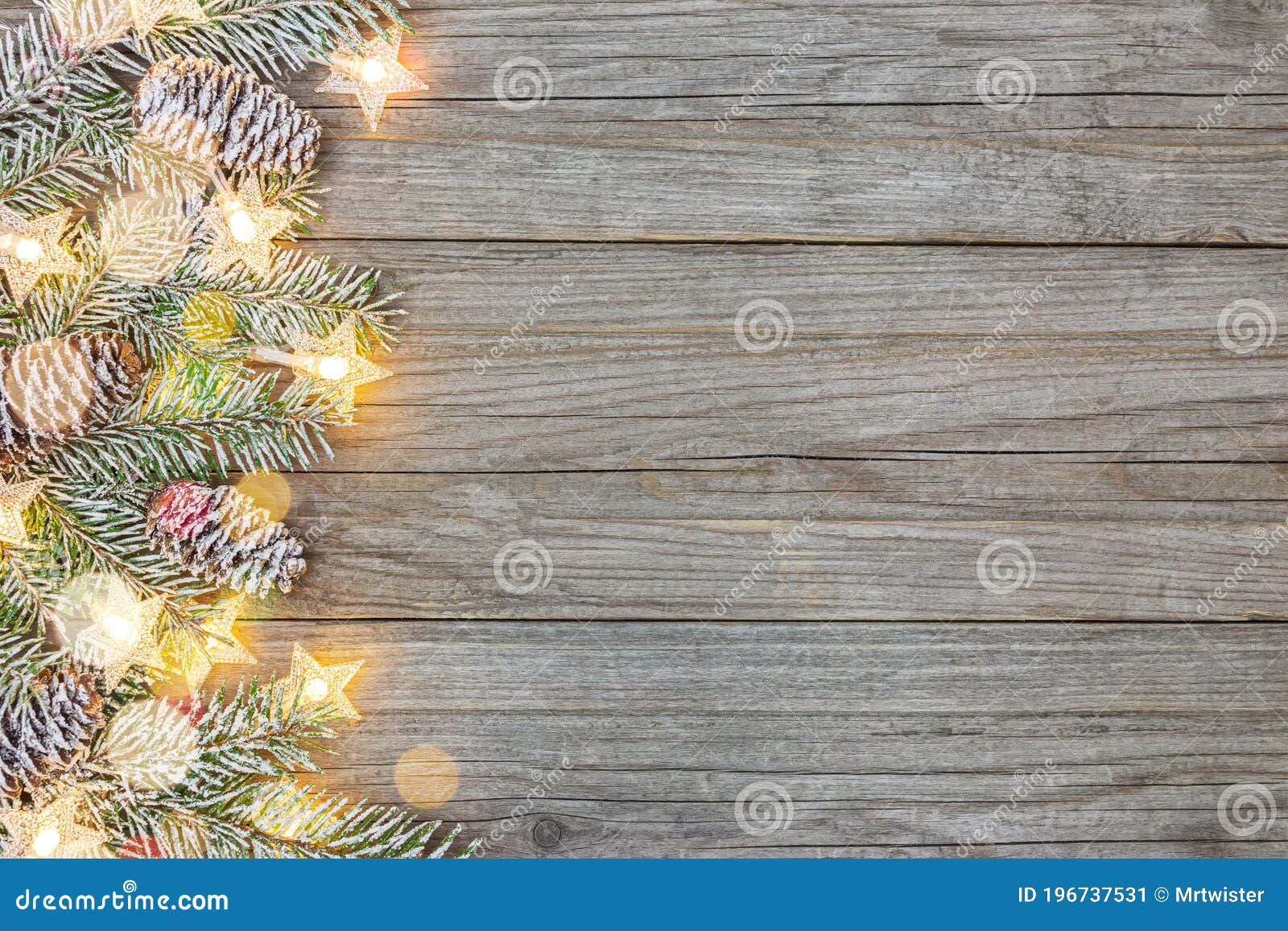 Frosty Christmas Tree Branch on Wooden Surface with Glowing Holiday ...