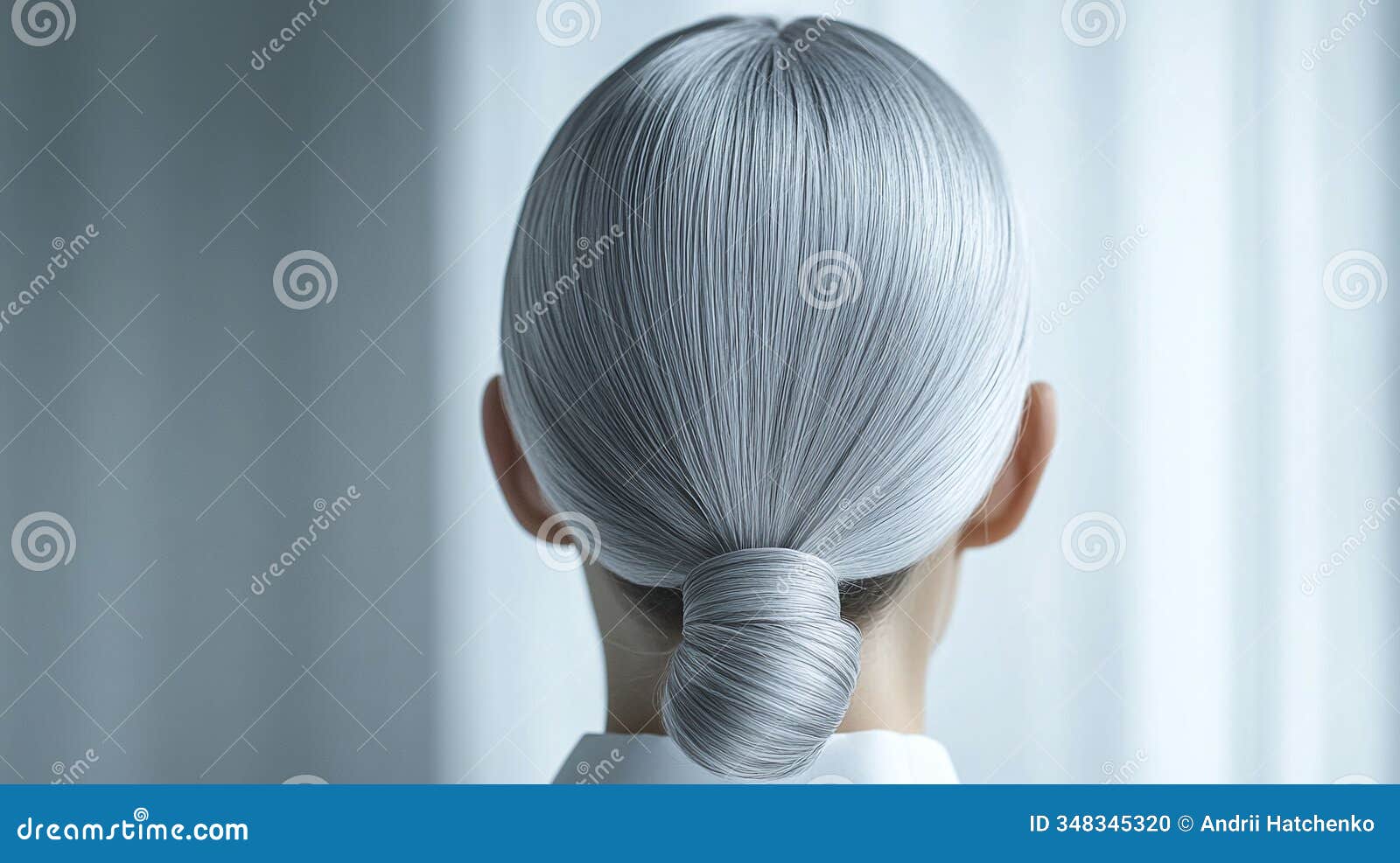 frosty silver gray slicked-back bun with a sharp perimeter sleek and contemporary style