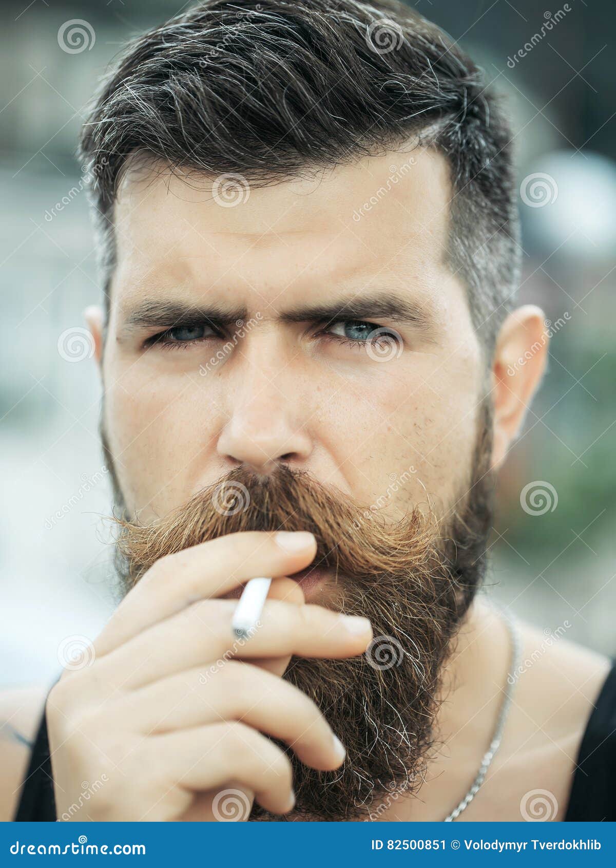 Frown Bearded Man Smoking Cigarette Stock Image - Image of handsome, young:  82500851