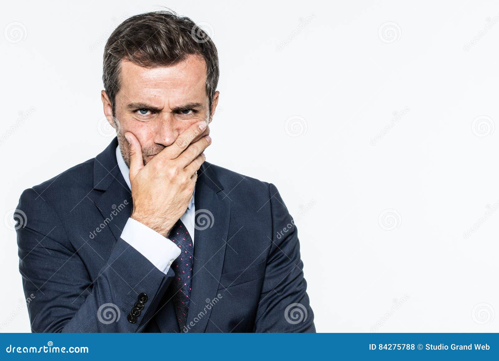 frowning unhappy businessman thinking, expressing corporate doubts and concerns