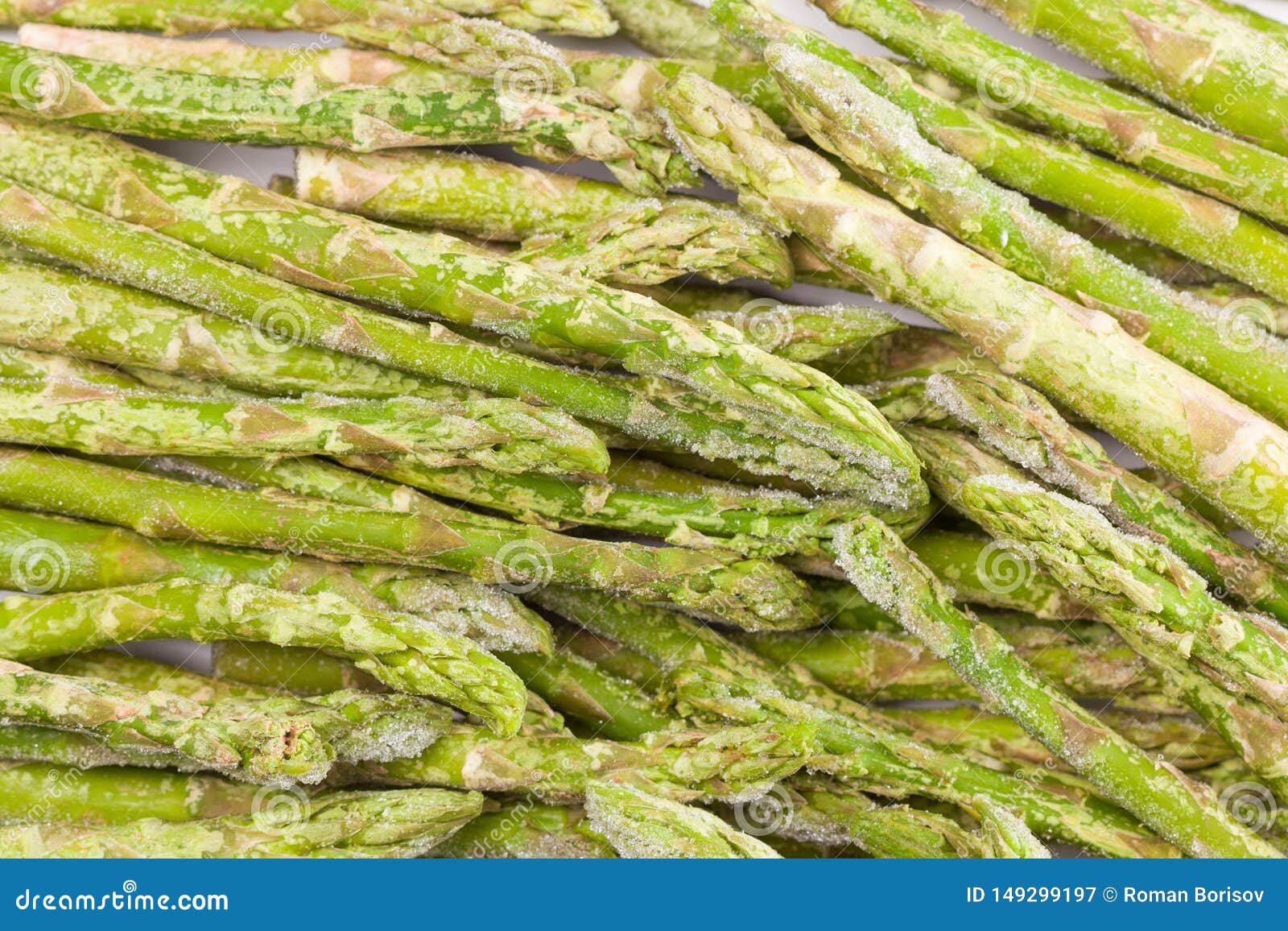 Frozen Asparagus on White Cutting Board, Top View, Macro Stock Image