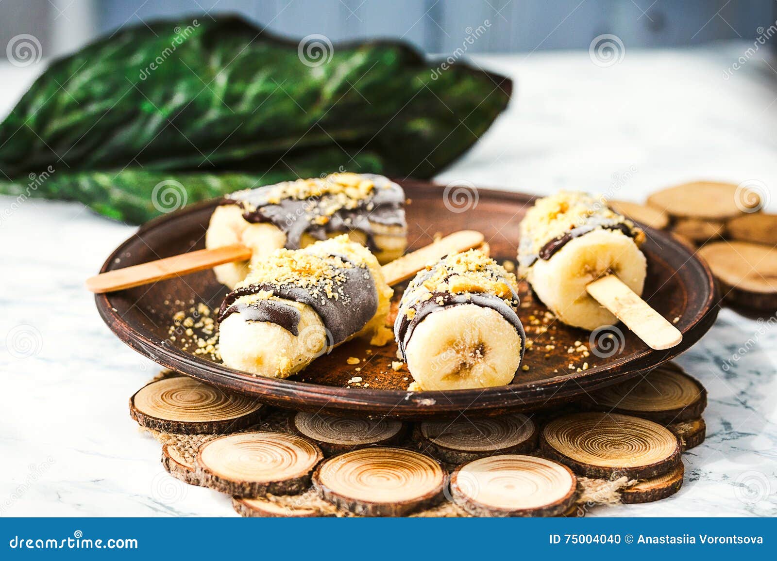 Frozen Bananas with Chocolate and Nuts, Raw Summer Dessert Stock Photo
