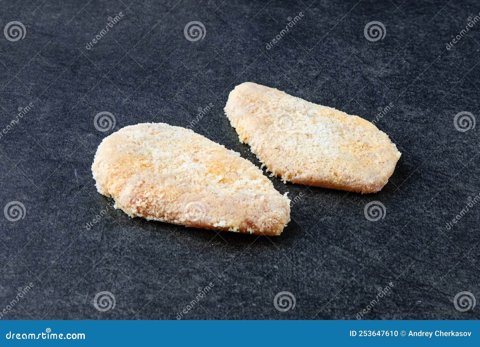 Frozen Chicken Cutlet on Stone Background. Frozen Semifinished