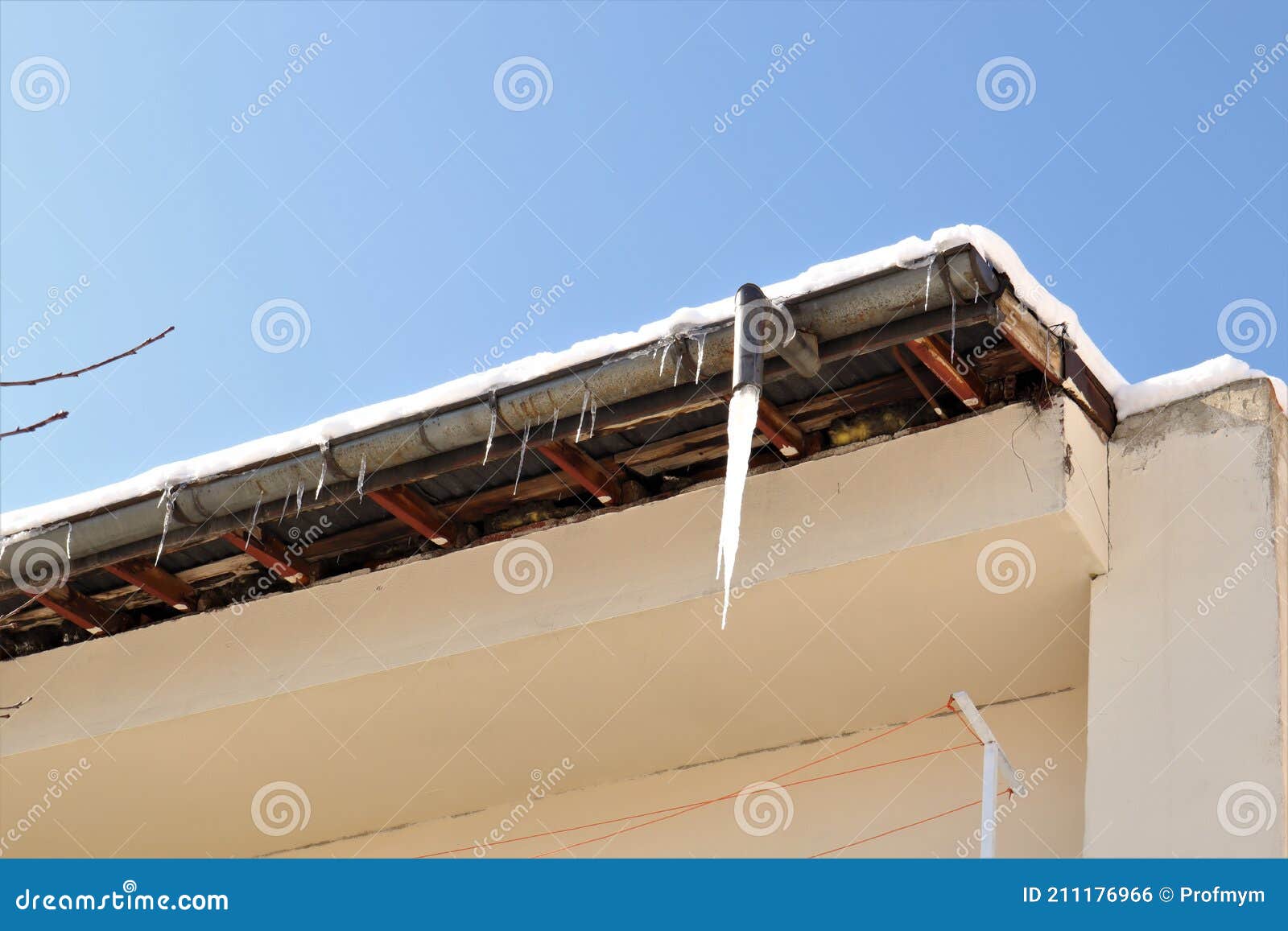 Frozen Downspout. Common Issue Your Gutter May Encounter during Winter