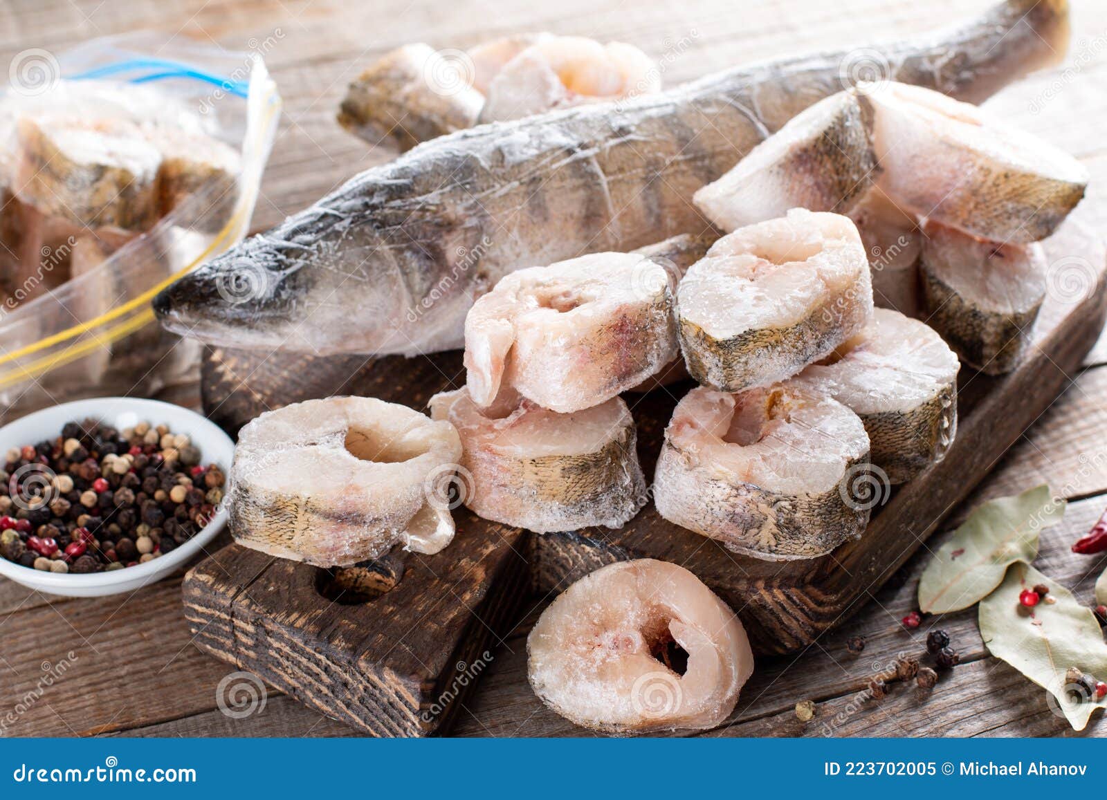 Frozen Fish on a Cutting Board on a Table. Frozen Food Stock Image