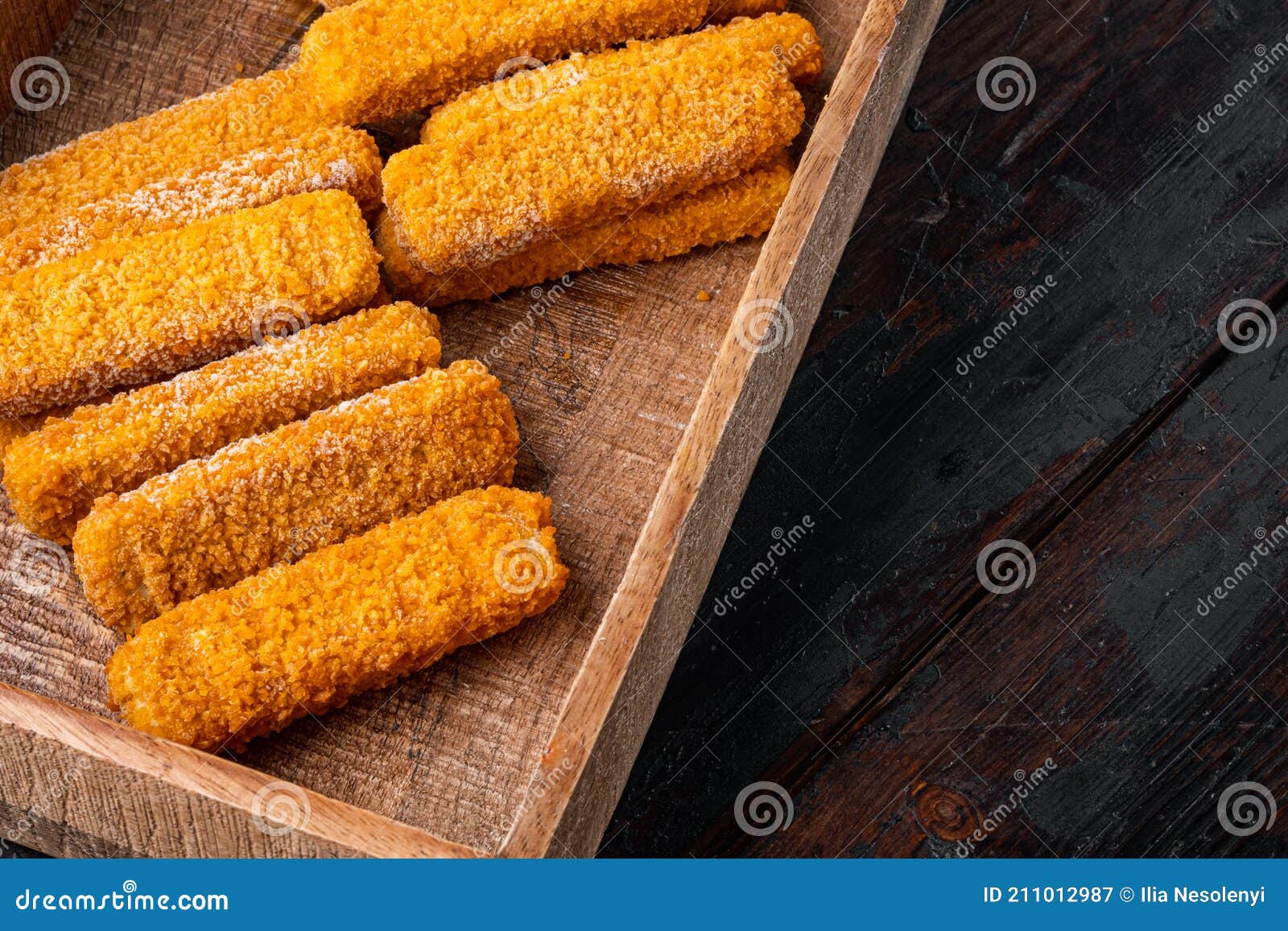 Frozen Fish Fingers, in Wooden Box, on Old Dark Wooden Table Background ,  with Copyspace and Space for Text Stock Image - Image of golden,  background: 211012987