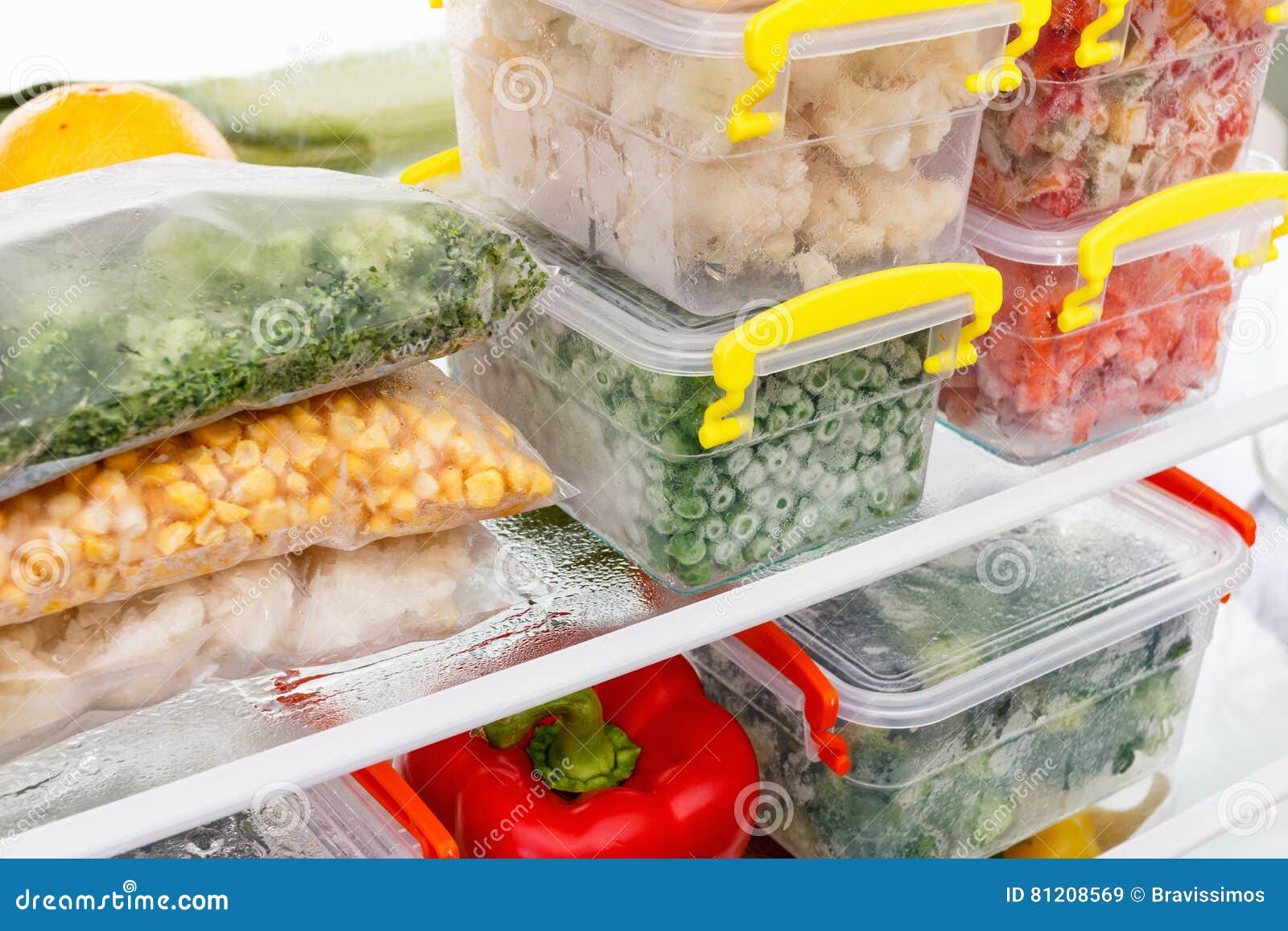 frozen food in the refrigerator. vegetables on the freezer shelves.