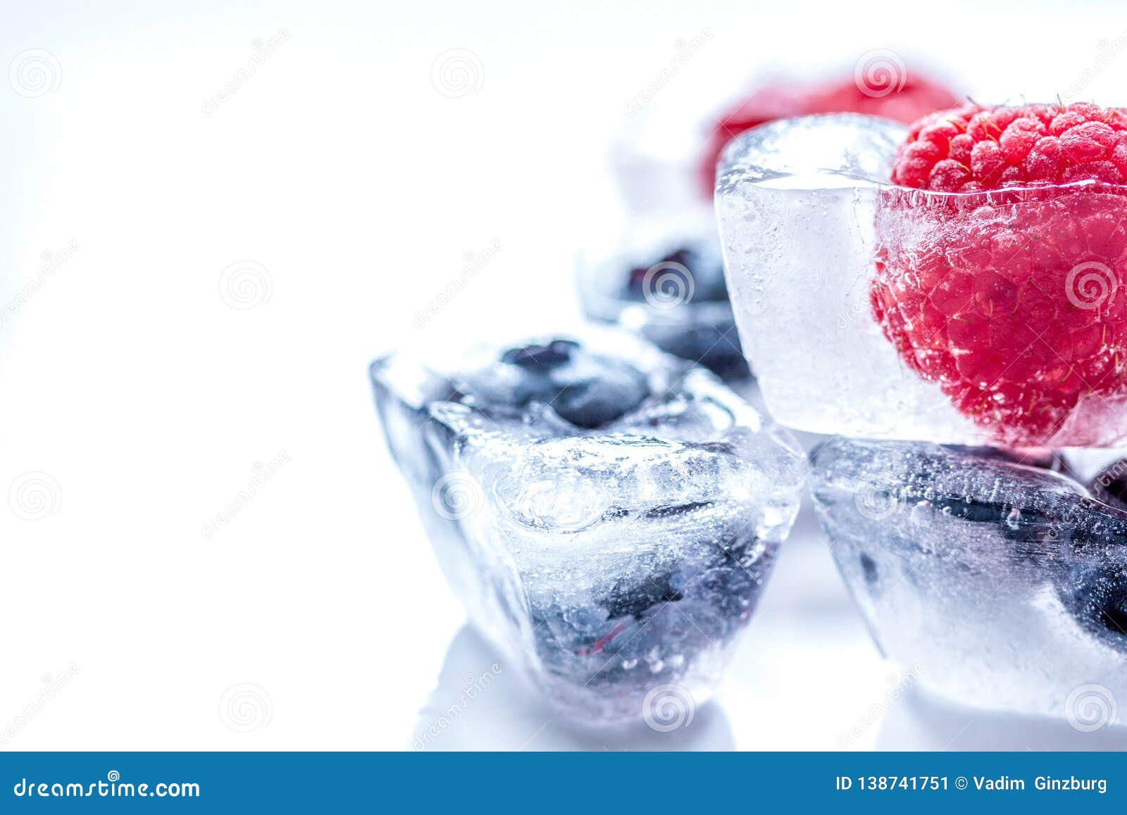 Download Frozen Blueberry And Raspberry In Ice Cubes On White Background Mock Up Stock Image - Image of ...