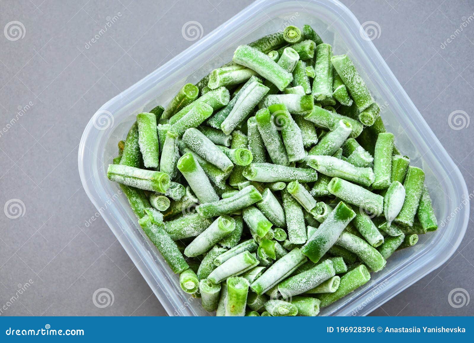 Frozen Green Beans in a Plastic Container for Longterm Storage. Deep