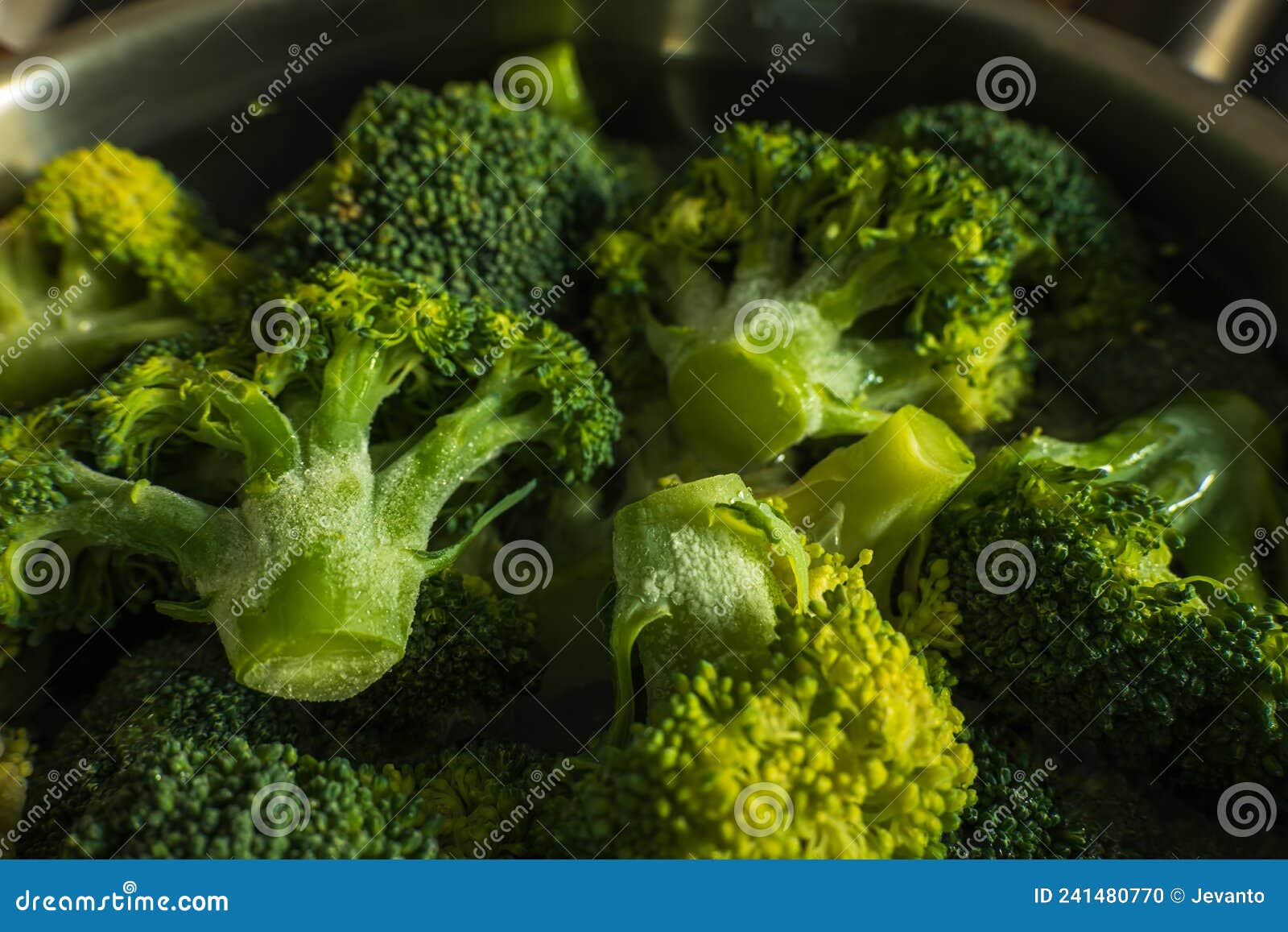 Frozen Green Broccoli Florets Inside Pan Casserole Ready for Boiling