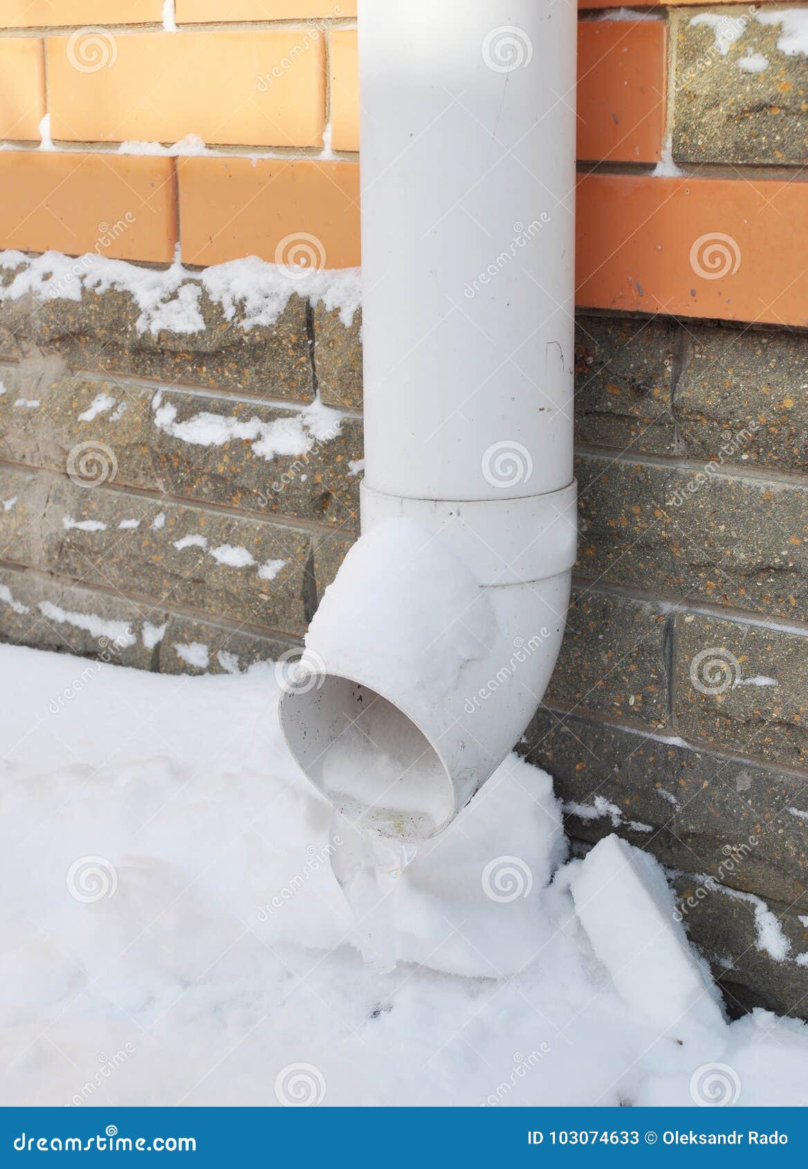 Frozen Gutter, Downspout Pipeline with Ice. Gutters Frozen Solid Stock