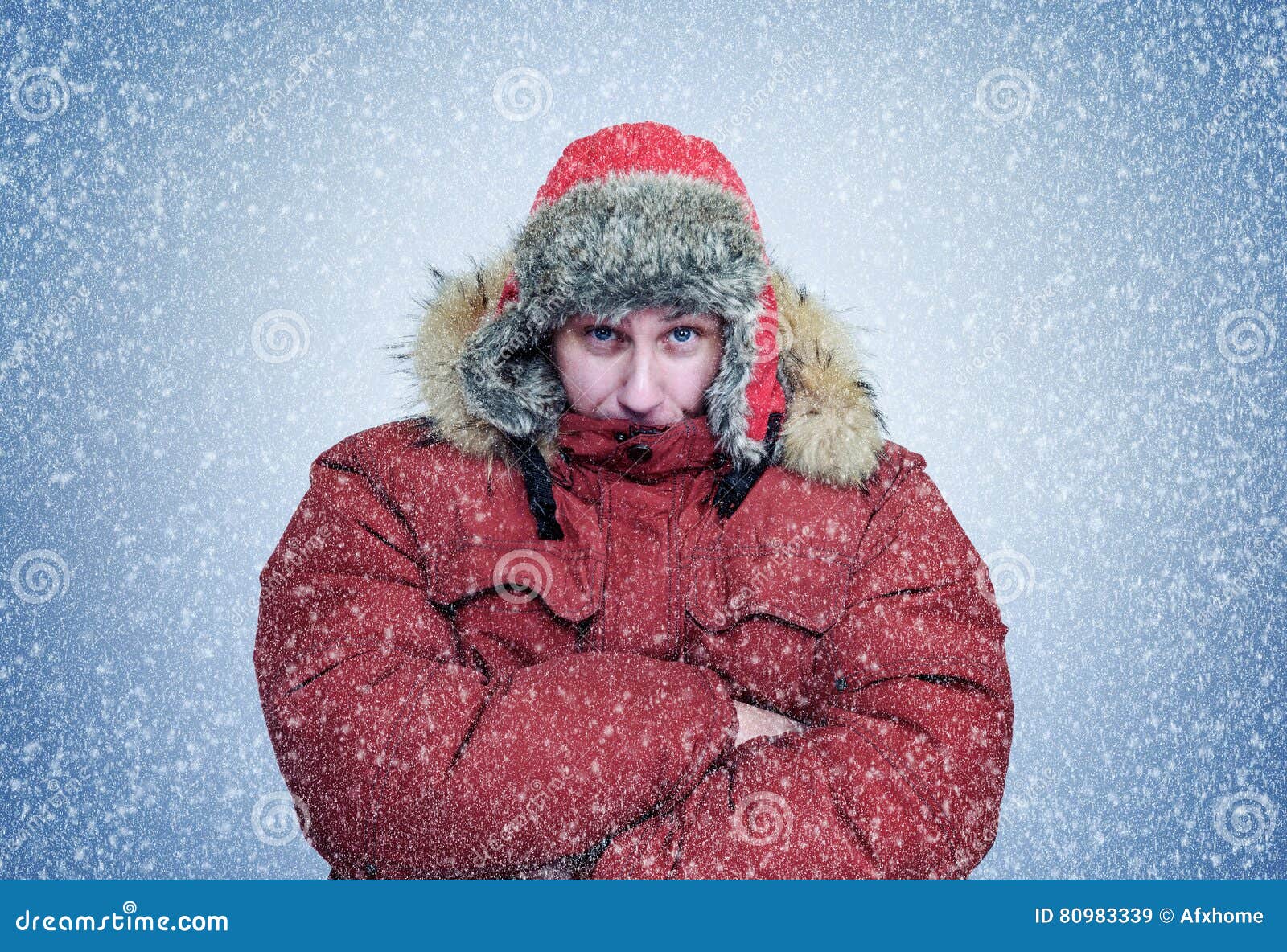 Frozen Man in Winter Clothes Warming Hands, Cold, Snow, Blizzard Stock