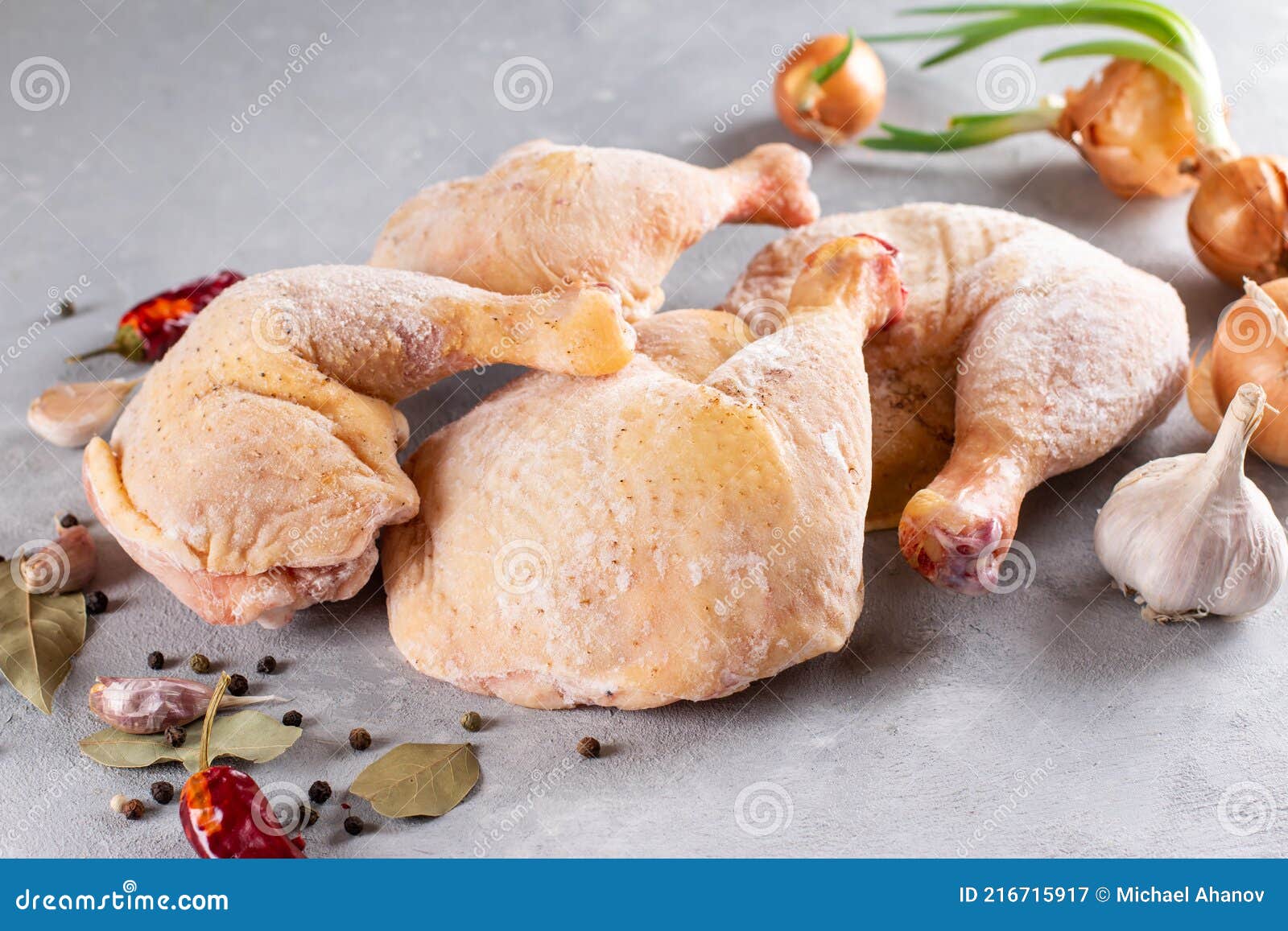 Frozen Meat. Frozen Chicken Legs on a Light Background. Raw Chicken