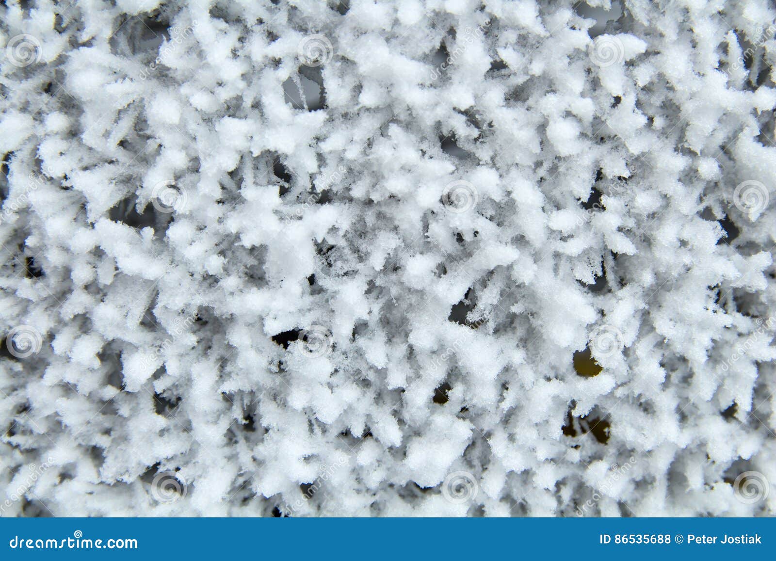 Frozen Metal Mesh Coated with Frost in the Cold. Background Stock Photo