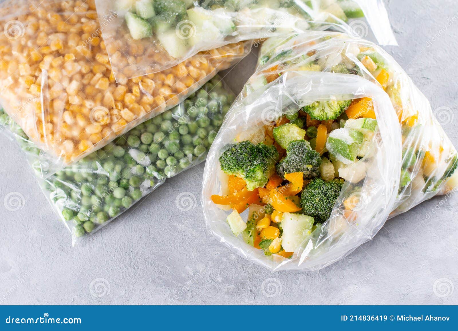 Frozen Mixed Vegetables in a Bag on a Light Concrete Background. Frozen