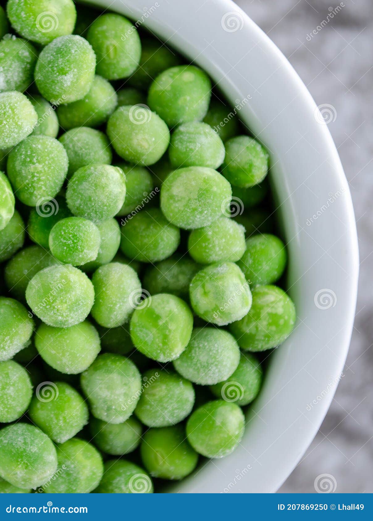 Frozen Peas in White Bowl stock photo. Image of vertical 207869250
