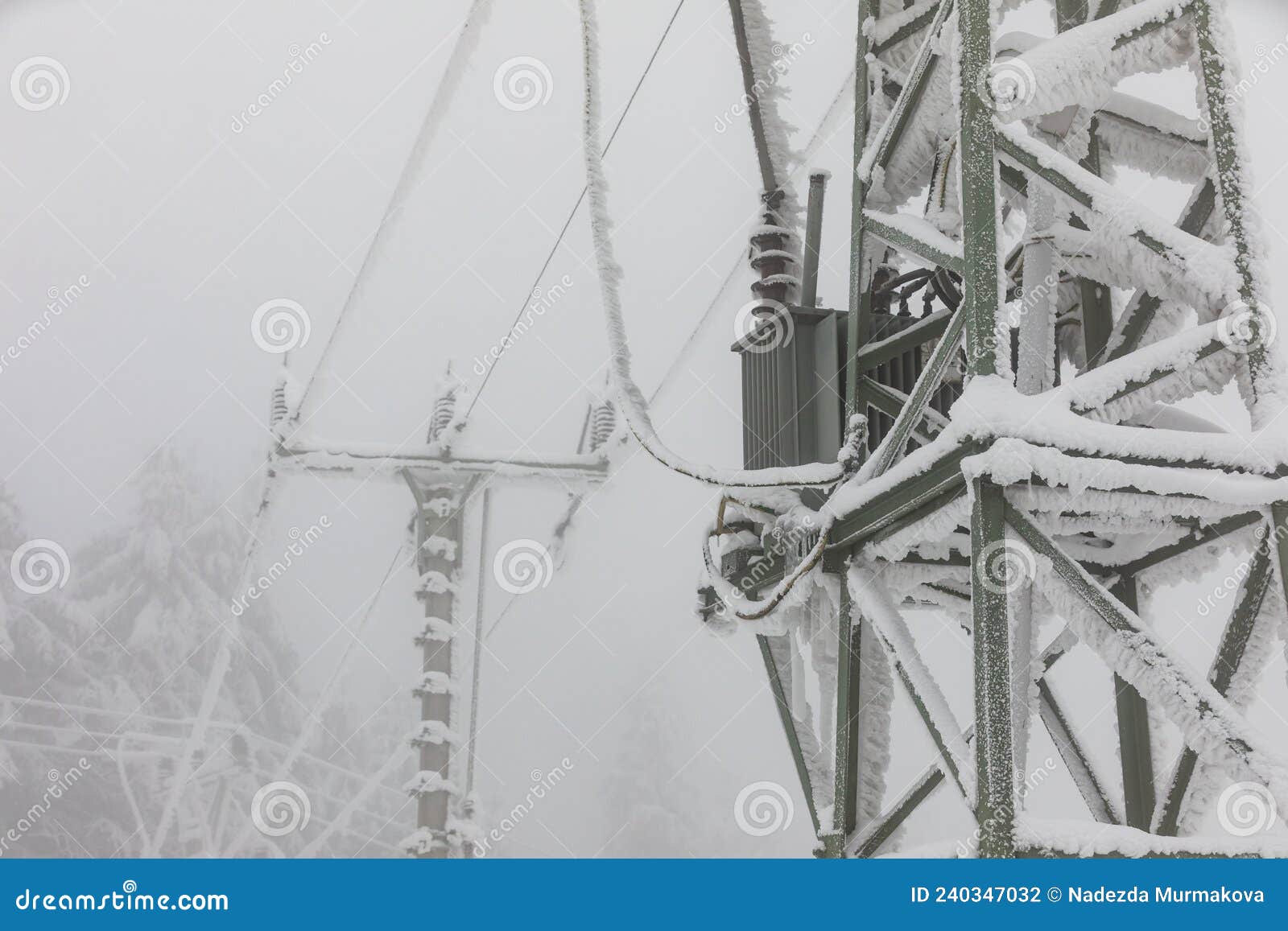 frozen power line pylons. hoarfrost on high voltage cables and pylons. winter in the mountains