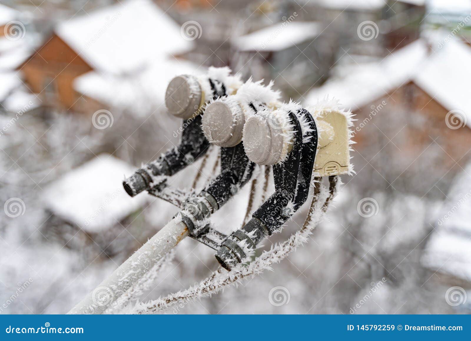 Frozen Satellite Dish. Snow Covered Satellite Dish and Receiver Head in