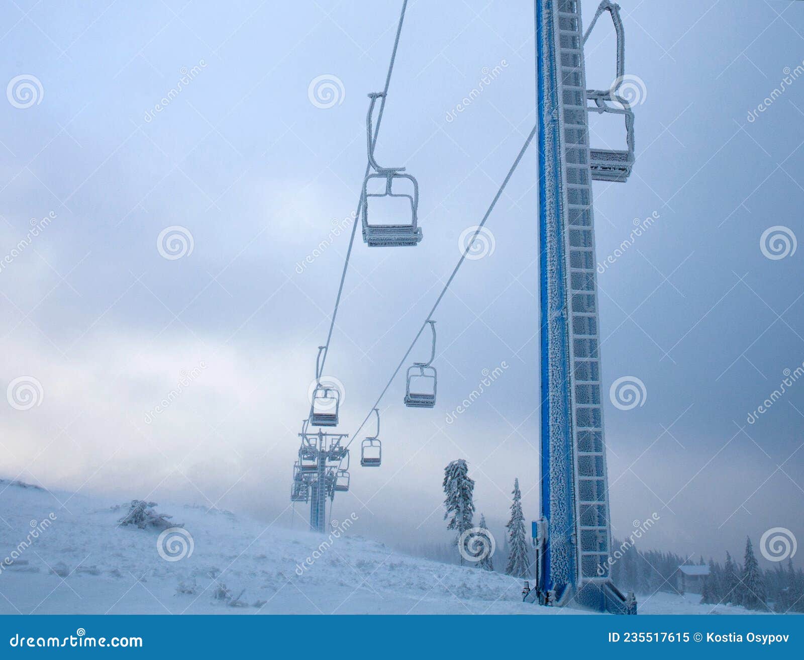 Frozen Ski Lift Covered with Frost on Gloomy Day in Snowy