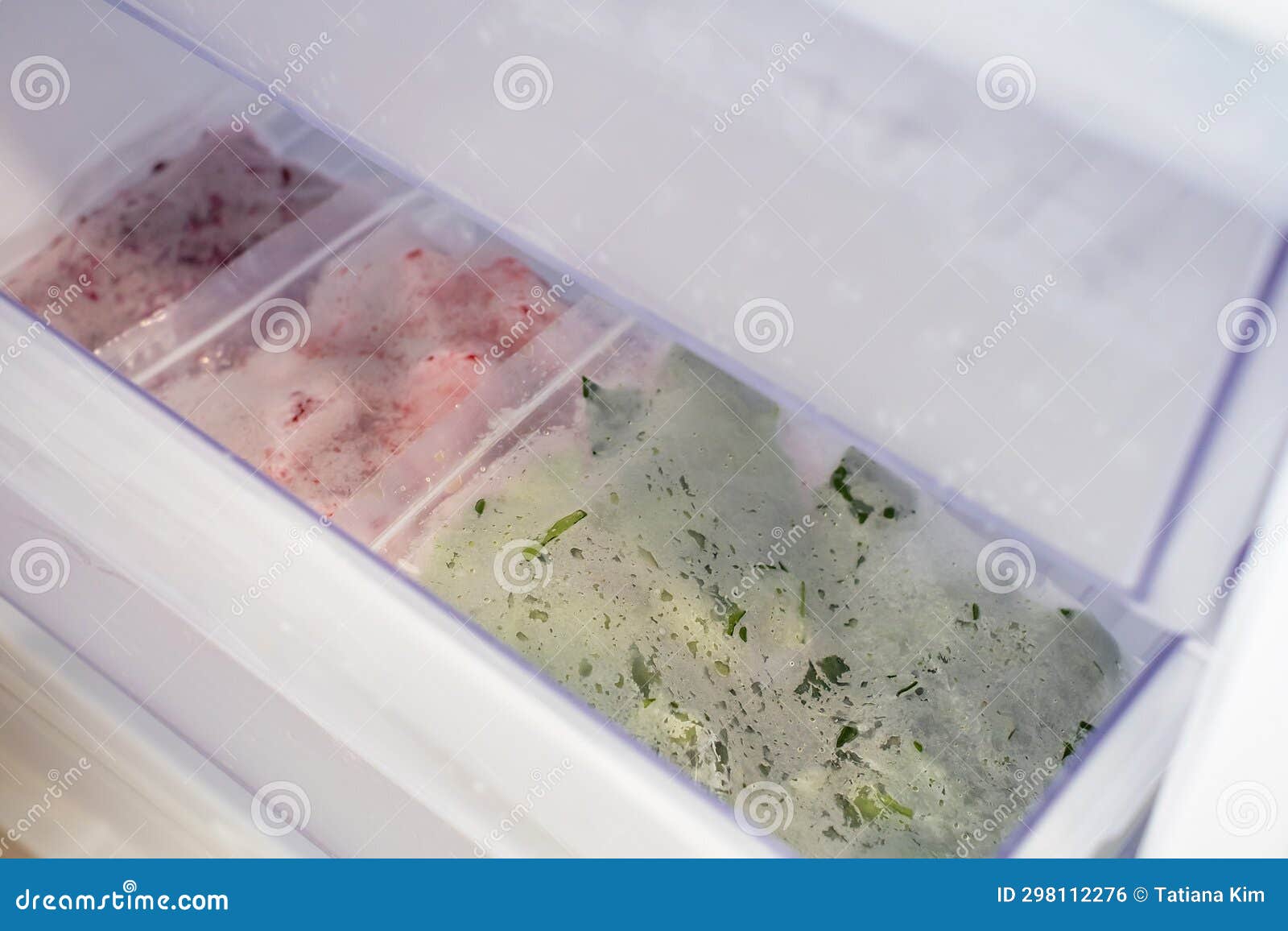 Frozen Vegetables in Plastic Bags in Freezer Closeup, Top View. Stock