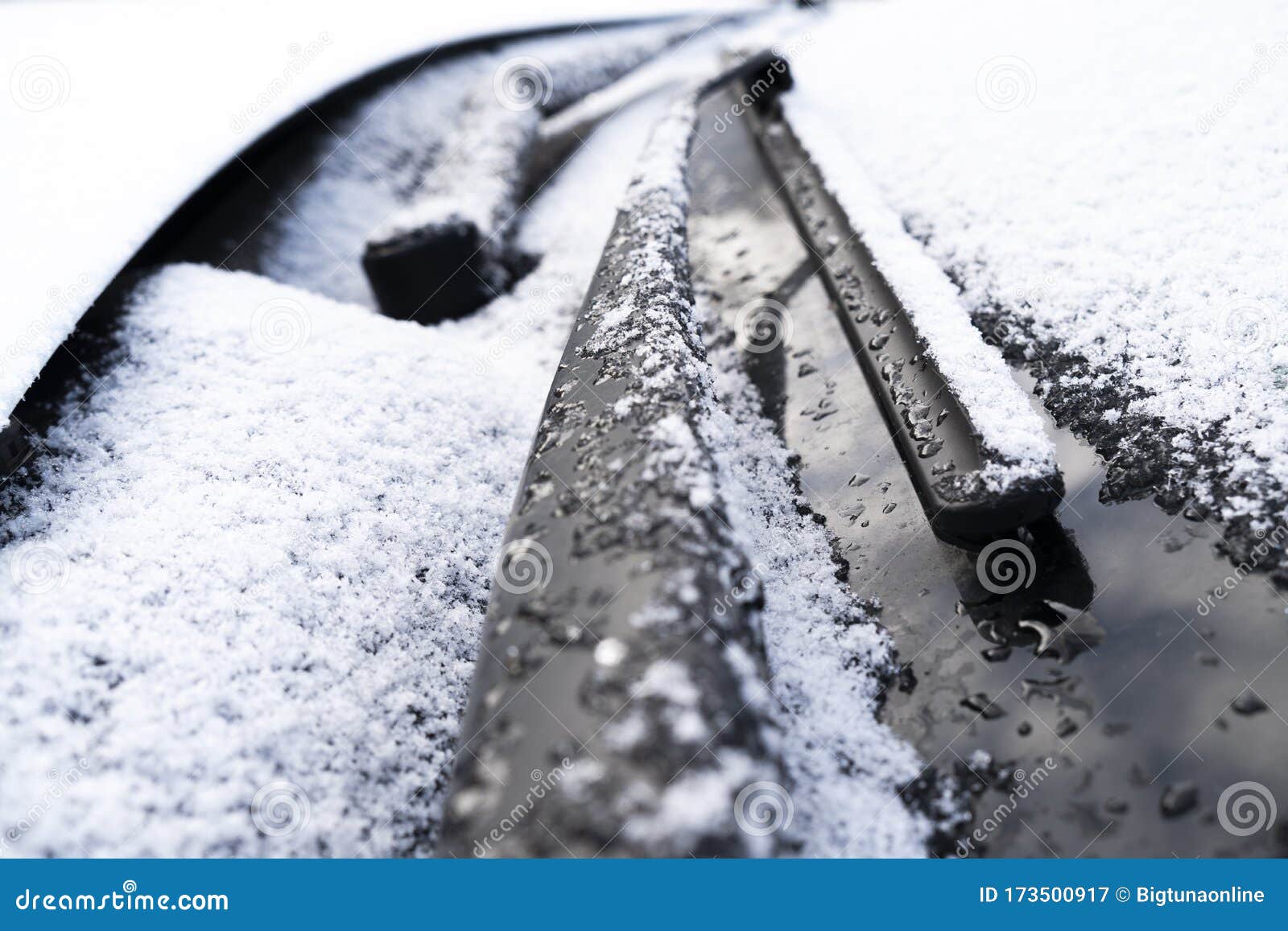 Frozen Windshield Wiper and Glass on Car. Close Up Frozen Windshield