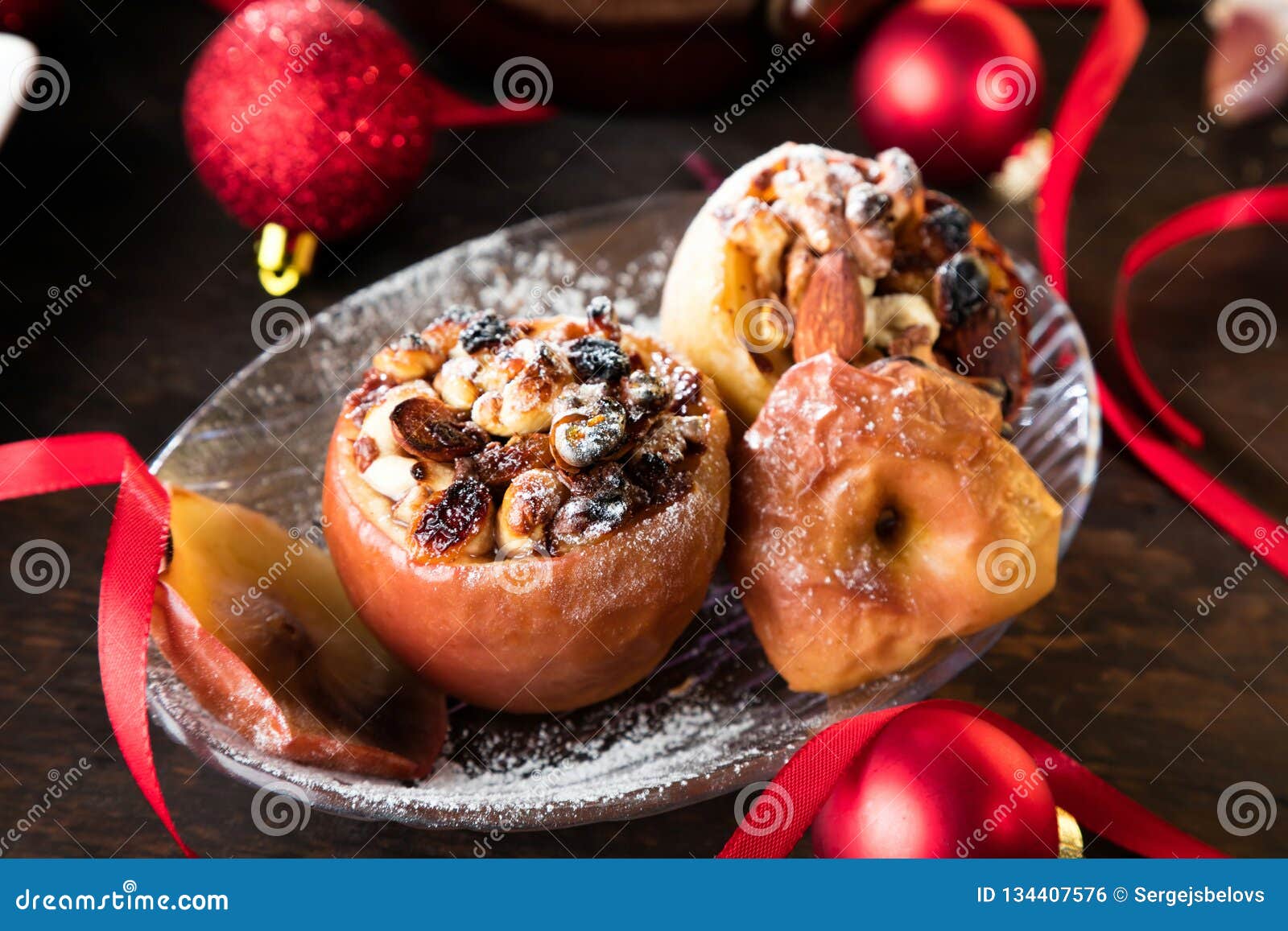 Fruit Dessert Baked Red Apples Stuffed with Granola. Stock Photo