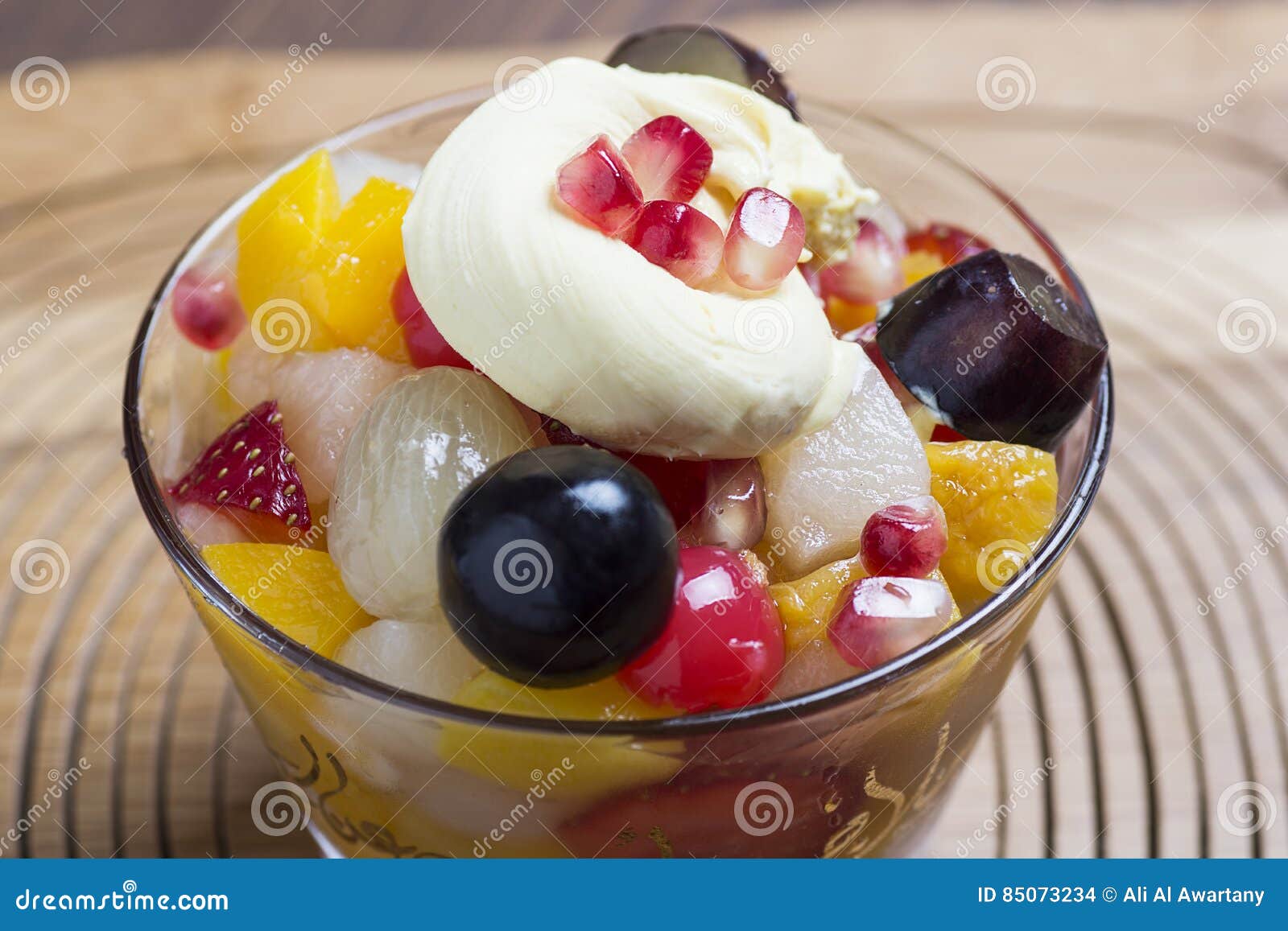 Fruit salad on glass bowl stock photo. Image of isolated 85073234