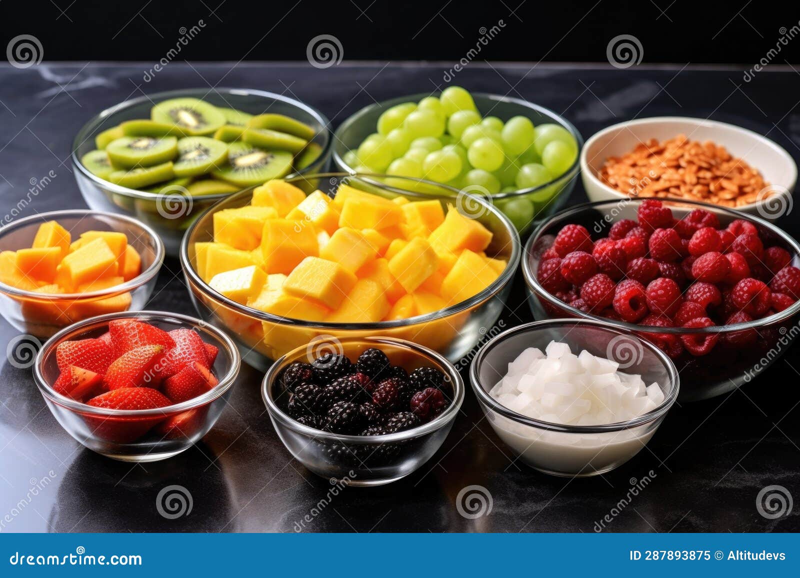 Fruit Salad Ingredients in Separate Bowls, Ready To Mix Stock