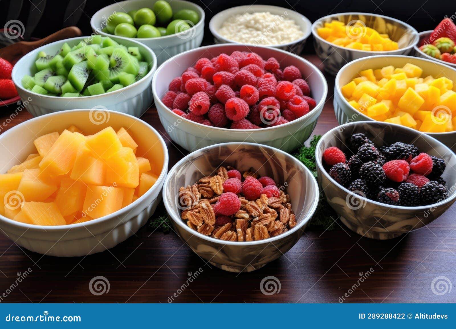 Fruit Salad Ingredients in Separate Bowls, Ready To Mix Stock Photo