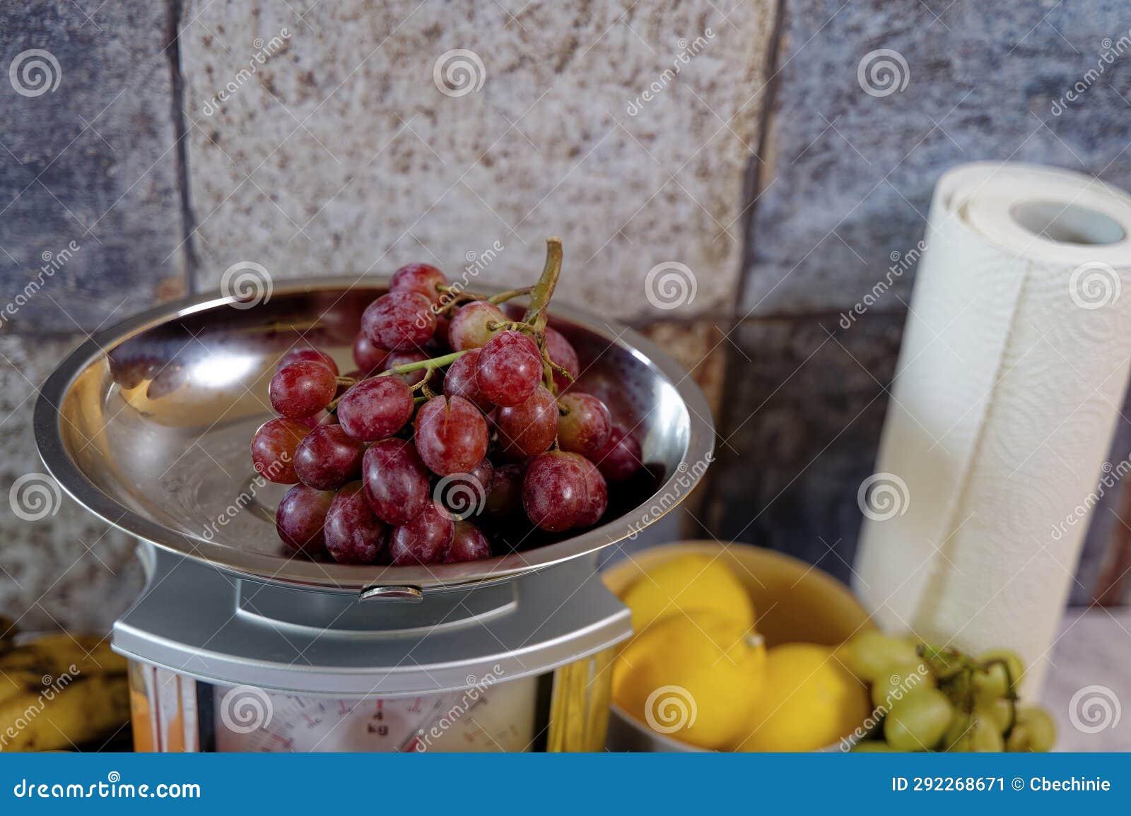 Fruits on a Kitchen Countertop and on a Kitchen Scale Stock Image