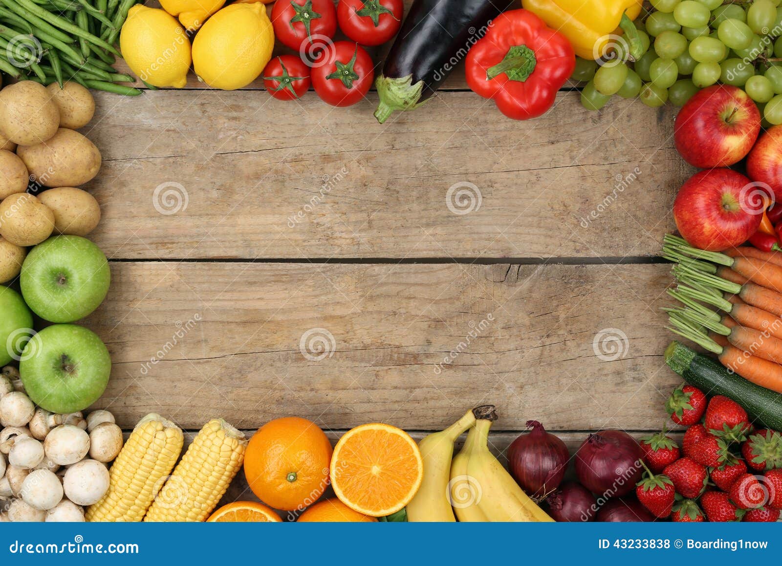 fruits and vegetables on wooden board with copyspace