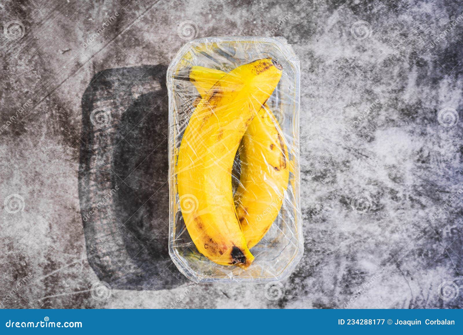Fruits Wrapped in Unnecessary Plastic in a Supermarket Stock Image