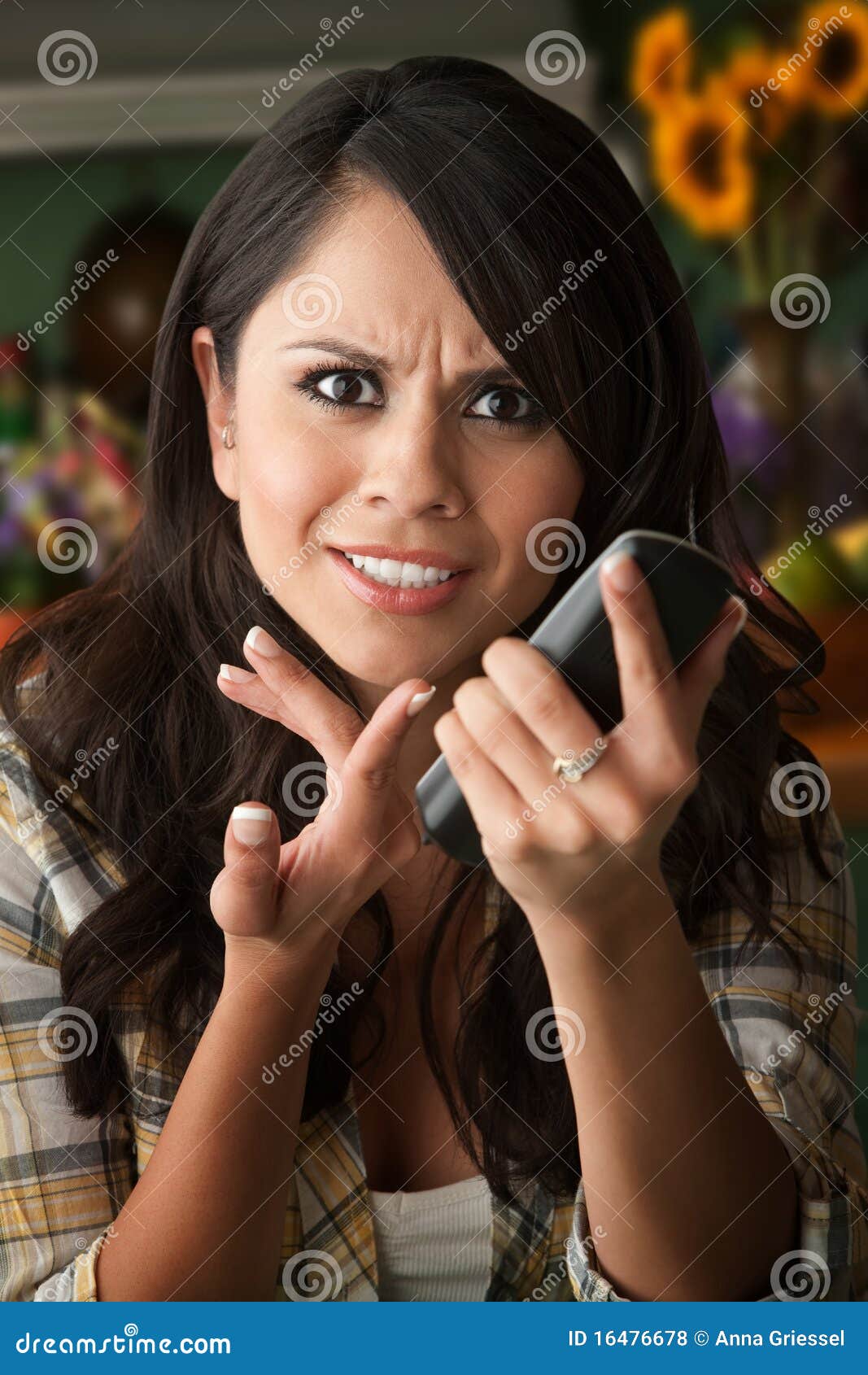 frustrated latina woman on phone