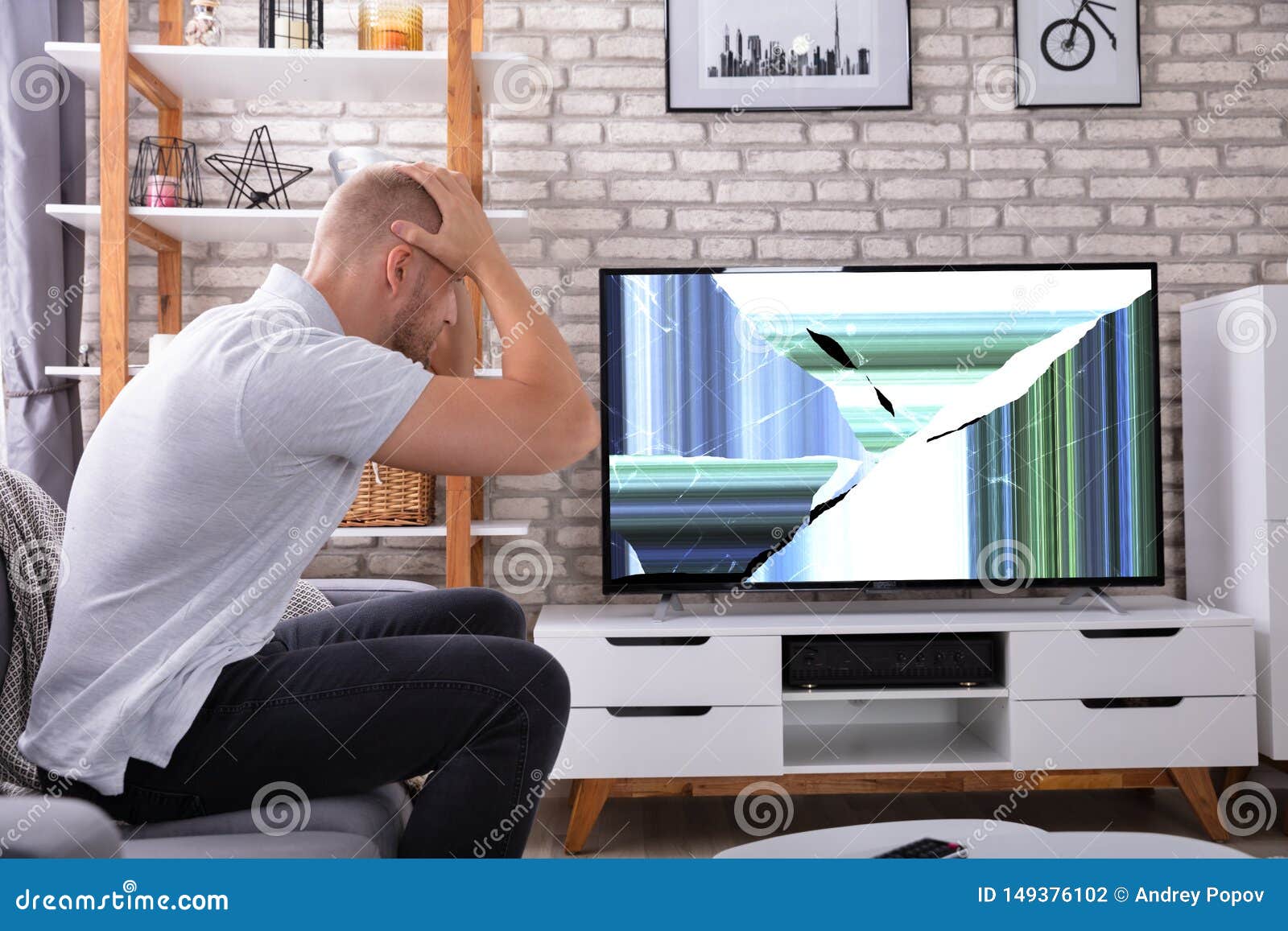 Frustrated Man Looking at Broken TV Stock Photo Image of