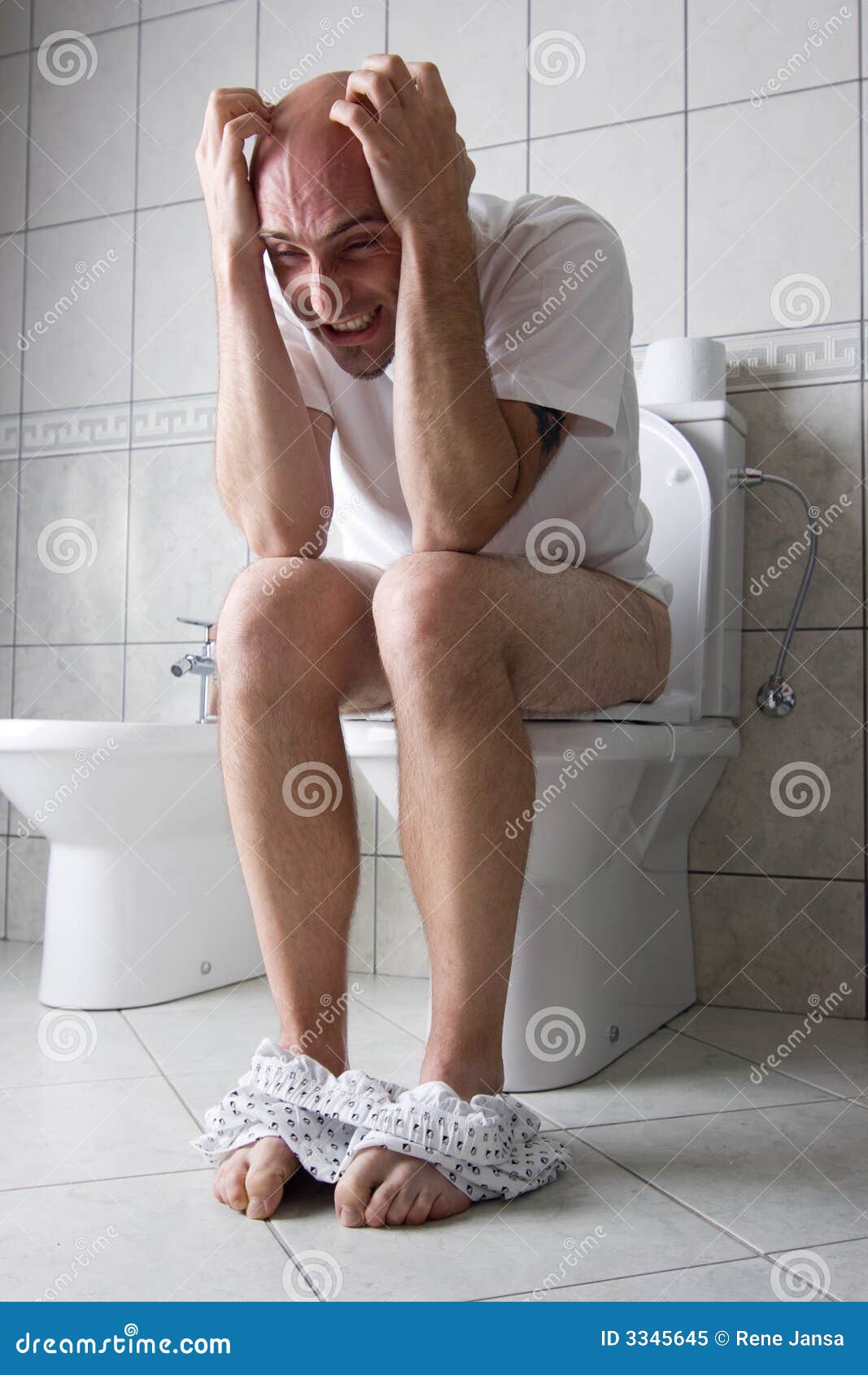 frustrated man on toilet seat