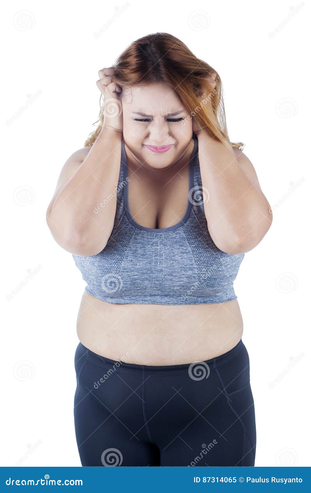 frustrated overweight woman in studio