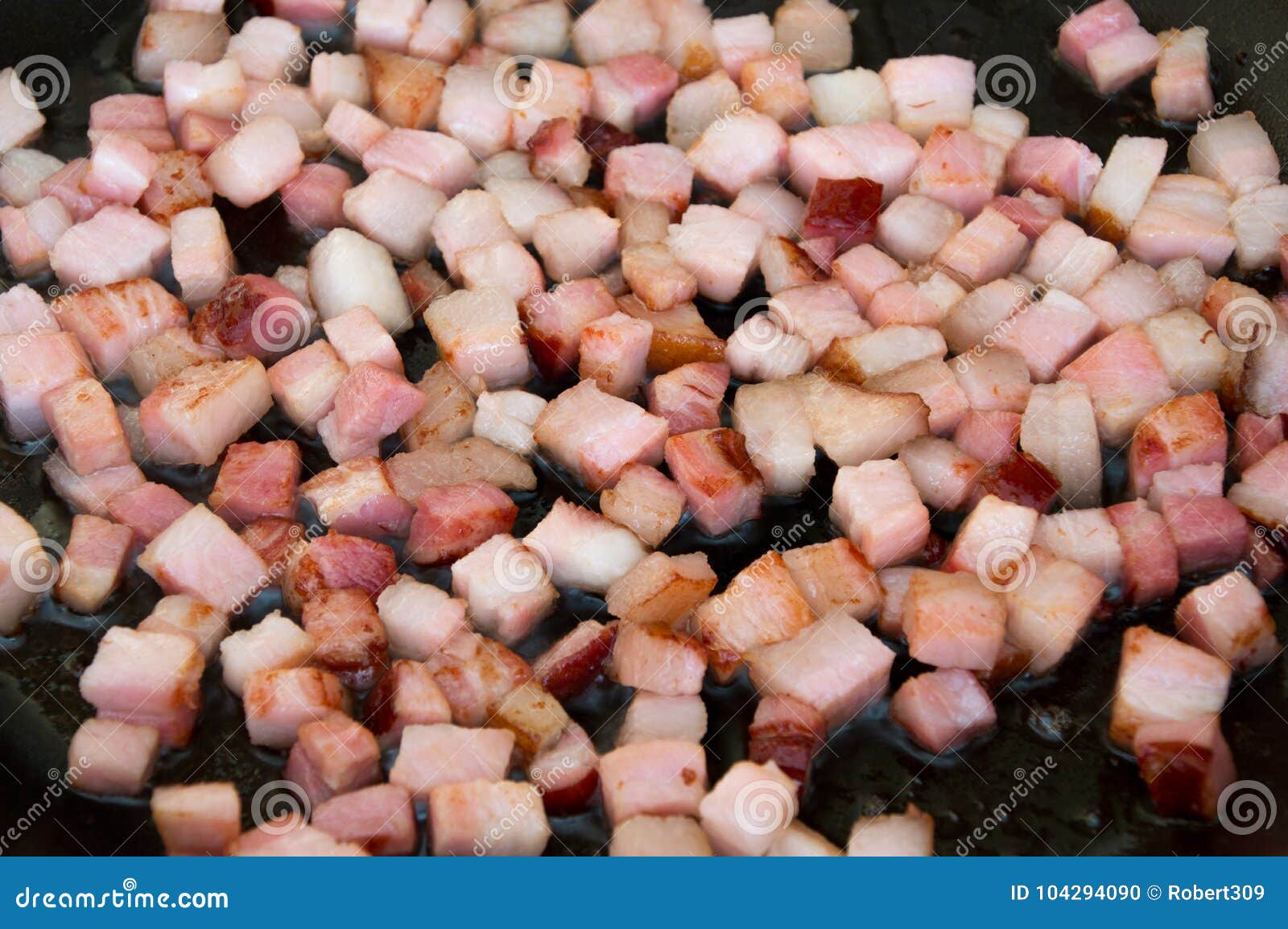 Frying chopped bacon. stock photo. Image of ingredient 104294090
