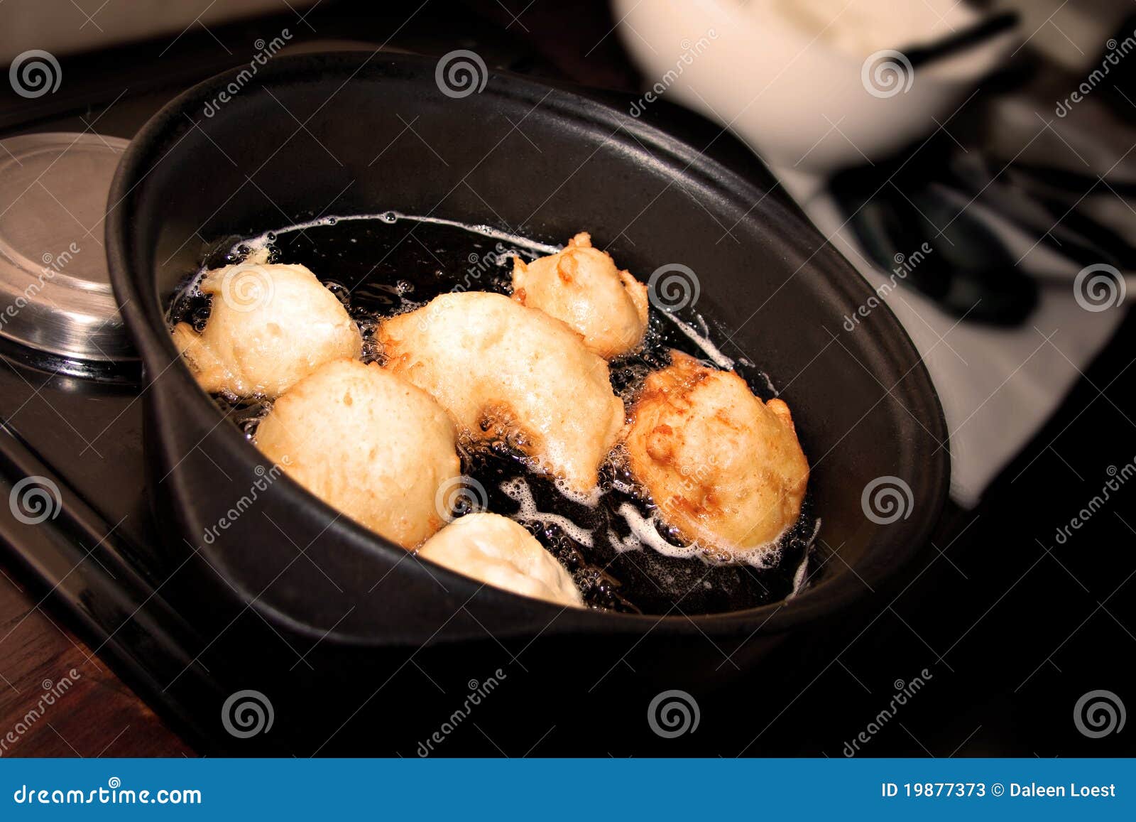 Frying doughnut oil stock image. Image of oily, food 19877373