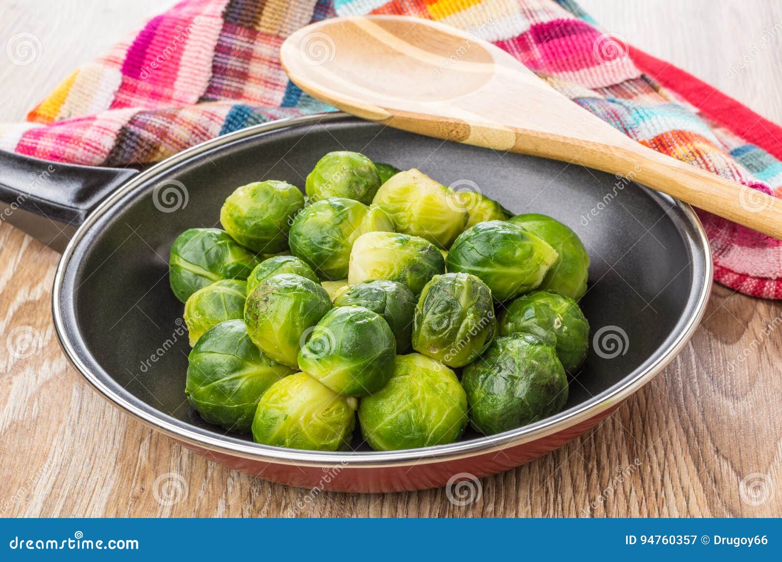 Frying Pan with Brussels Sprouts, Wooden Spoon and Napkin Stock Image